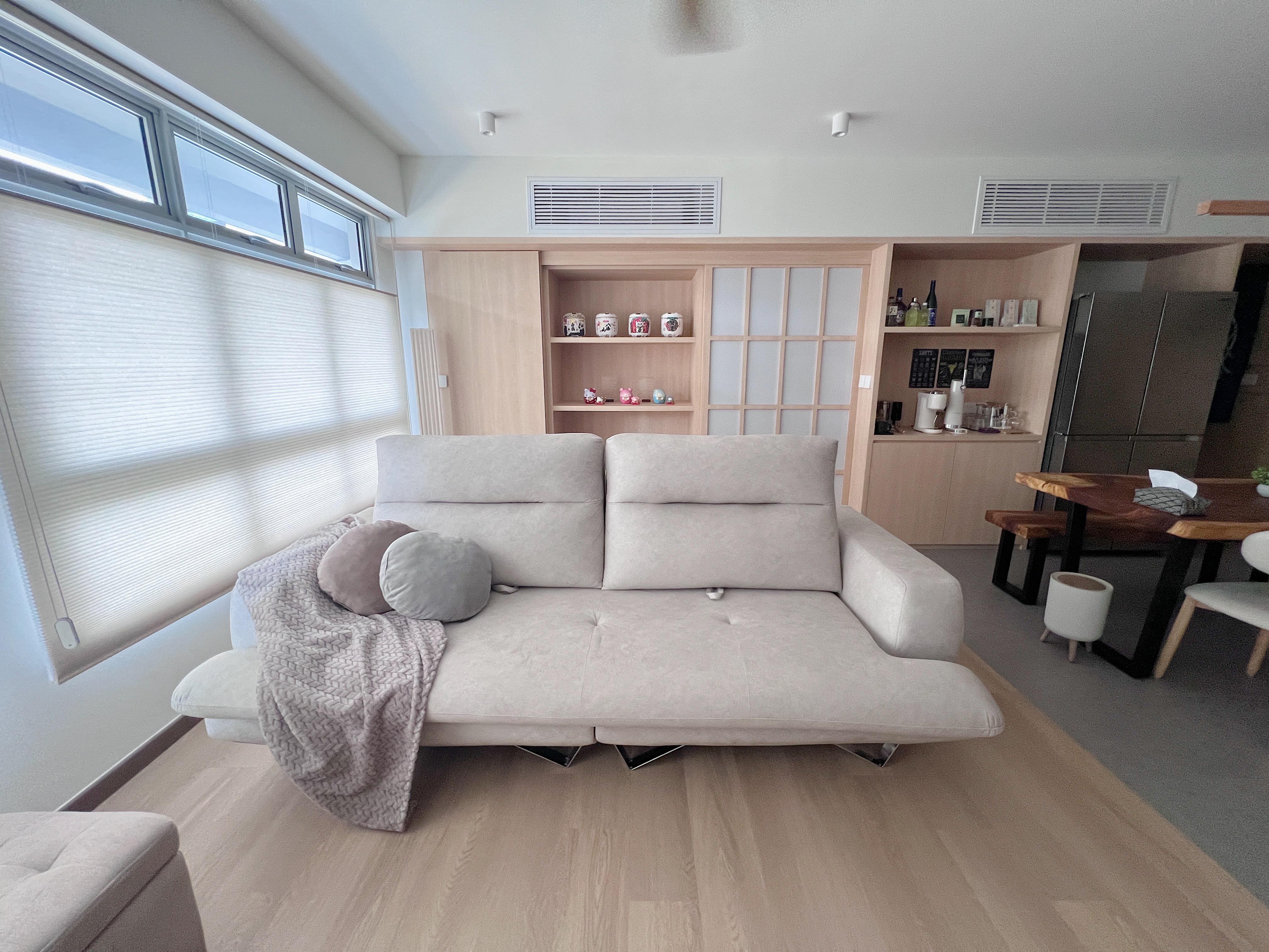 Into our Modern Japanese zen living room - Light-colored sofa, minimalist decor, large window with blinds, wooden shelves