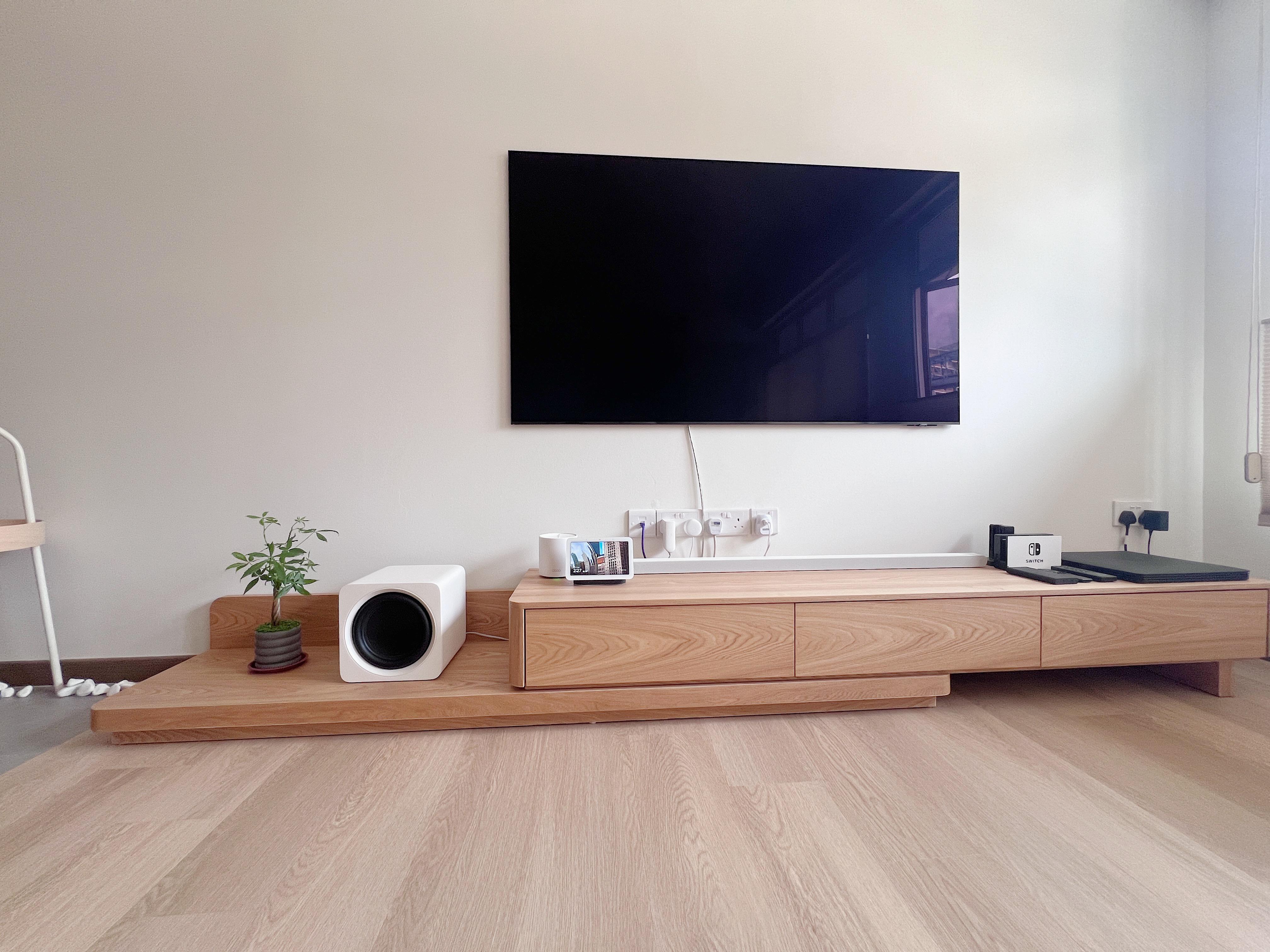 Into our Modern Japanese zen living room - Wooden entertainment center, modern TV, minimalist decor, sleek white speaker