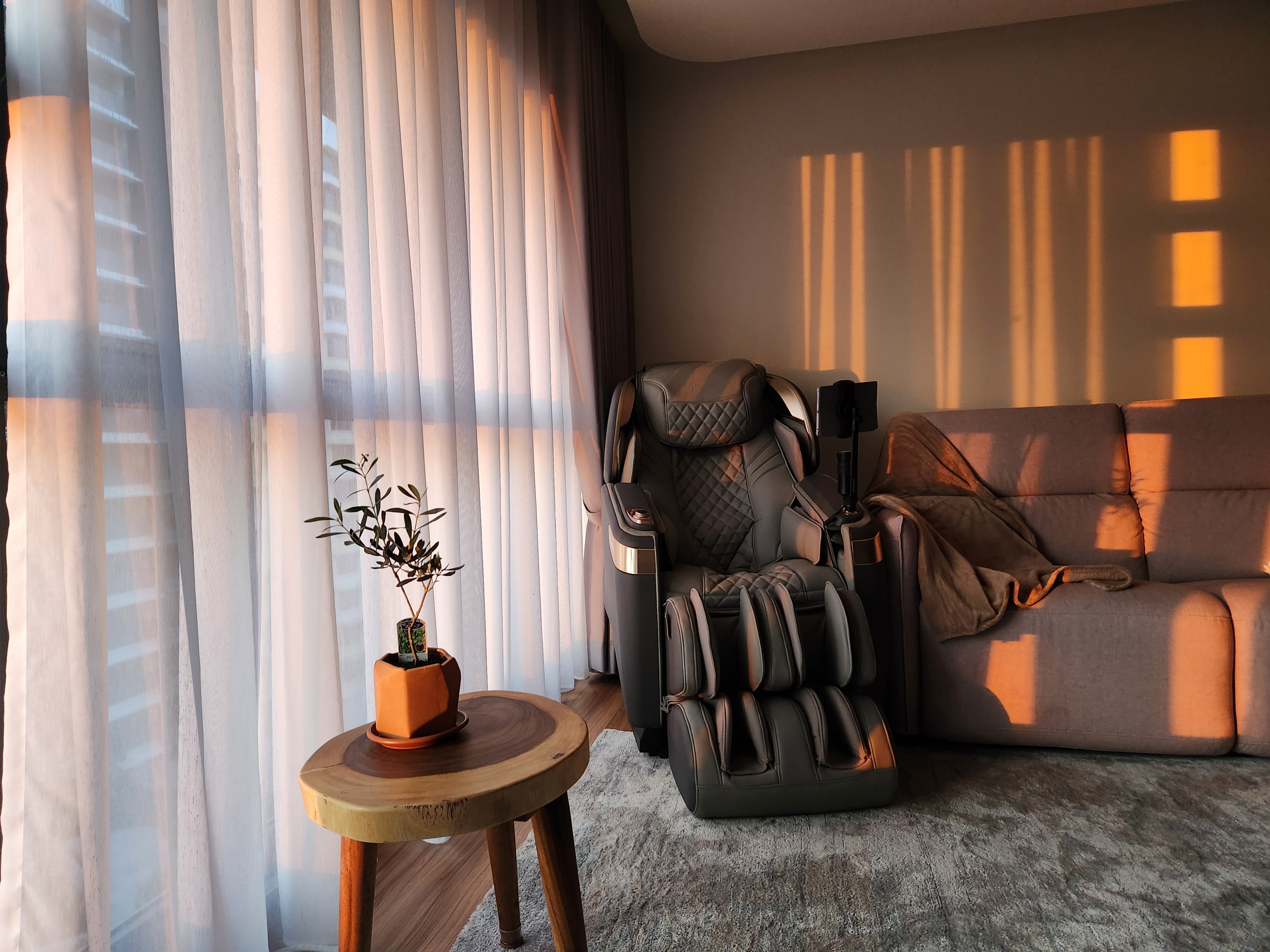 Maximising Space In Our 5m Long Living Room - Sunlight streaming through sheer curtains, warm indoor lighting, cozy indoor