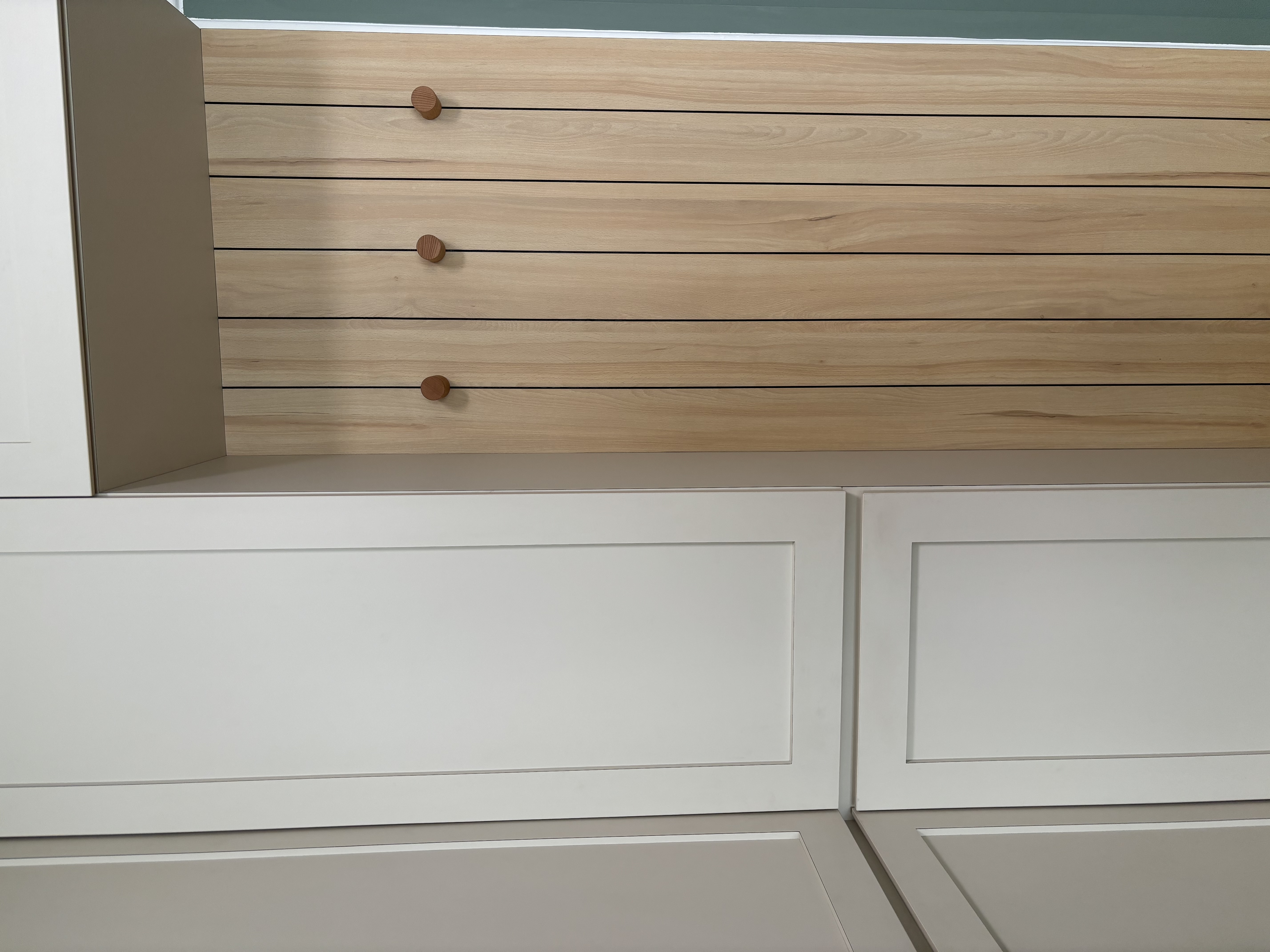 Spacious Entryway with a blend of Coastal Farmhouse - Wooden kitchen cabinets with smooth surfaces, light beige upper panel