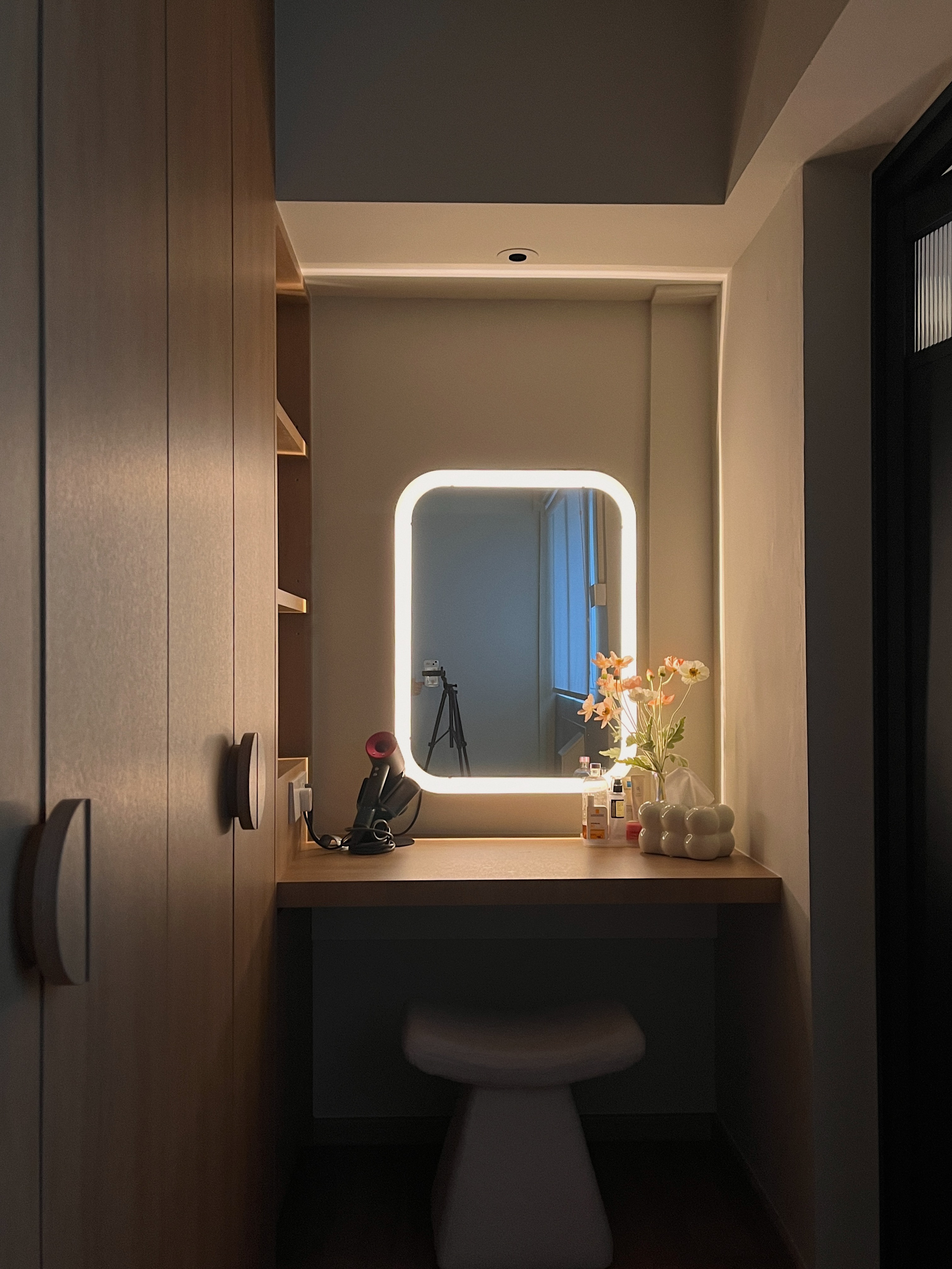 Lighting Tips: Creating Warmth and Style with Lighting - Modern minimalist bathroom, sleek vanity, illuminated mirror, wooden