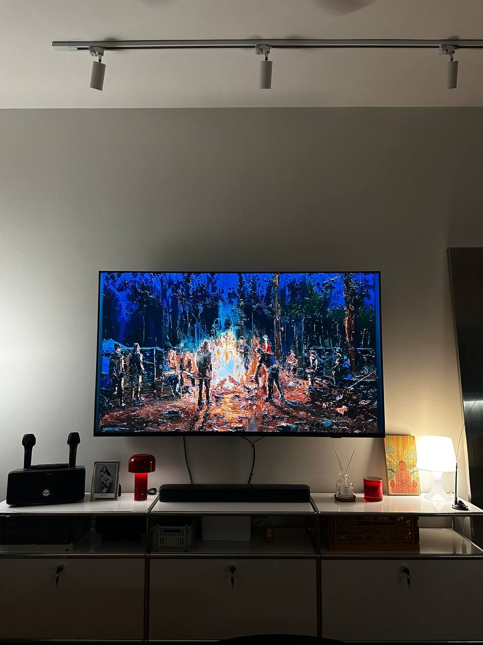 How we style a living room with no built ins!  - Vivid, colorful painting on wall, Large flat-screen TV display, Forest scene
