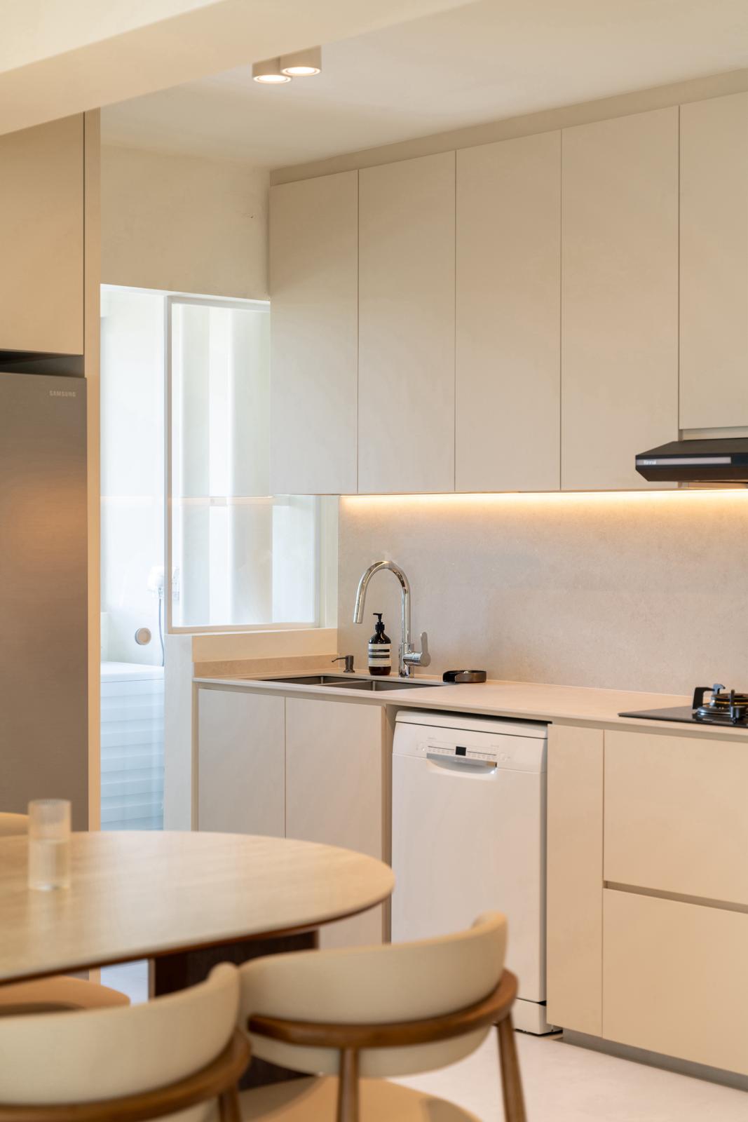 Heart Of The Home: Creating My Dream Cream Kitchen - Modern kitchen with sleek cabinets, stainless steel refrigerator