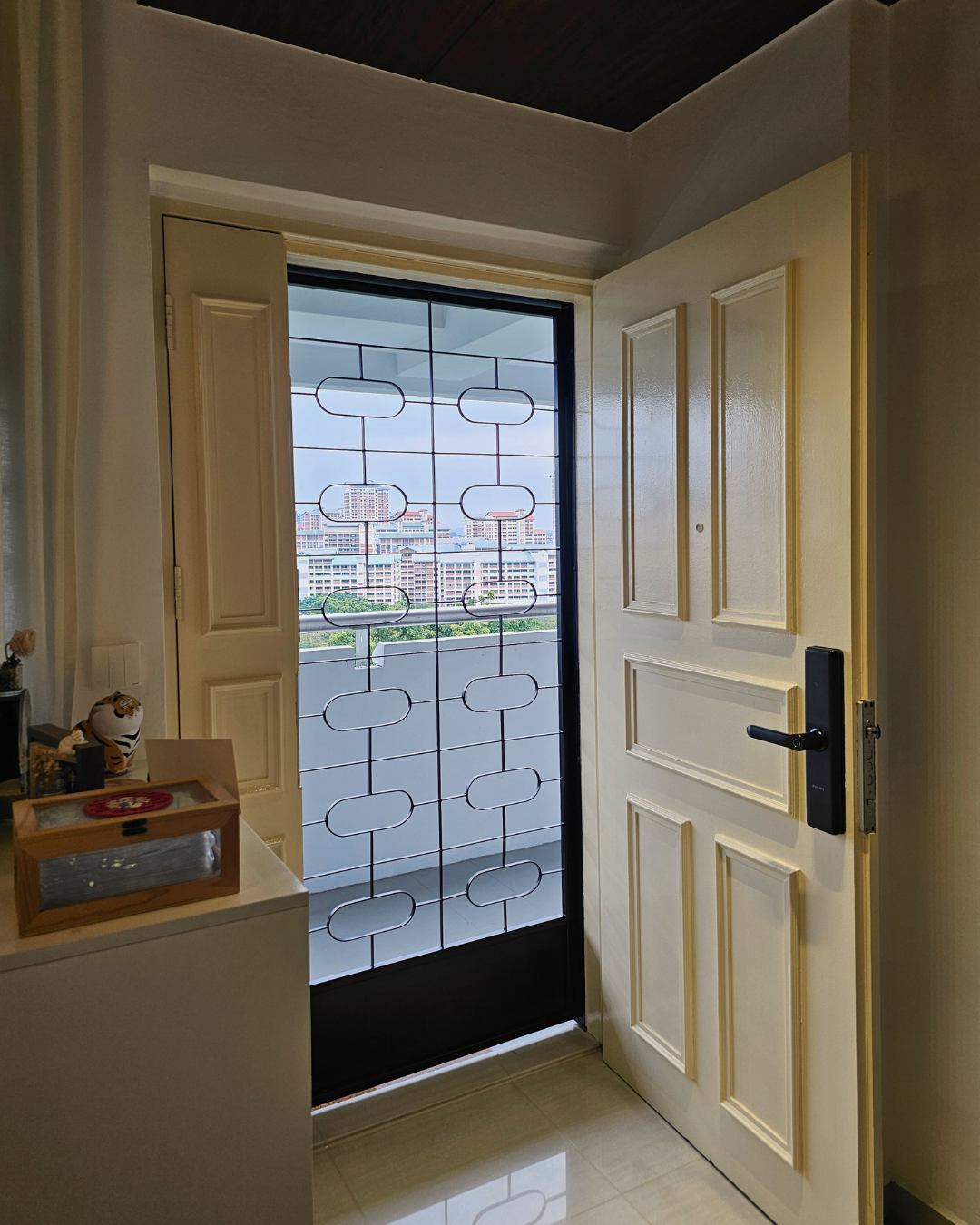 Our Top 3 Entryway Highlights: Function, Style & Personal Touches - Glass door, balcony, indoor view, cityscape, buildings