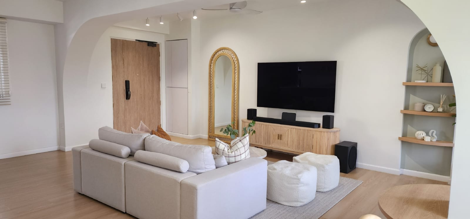 Our Living Room: Bright, Soft, and Beautifully Airy - Modern living room with beige sectional sofa, wooden floor, minimalist