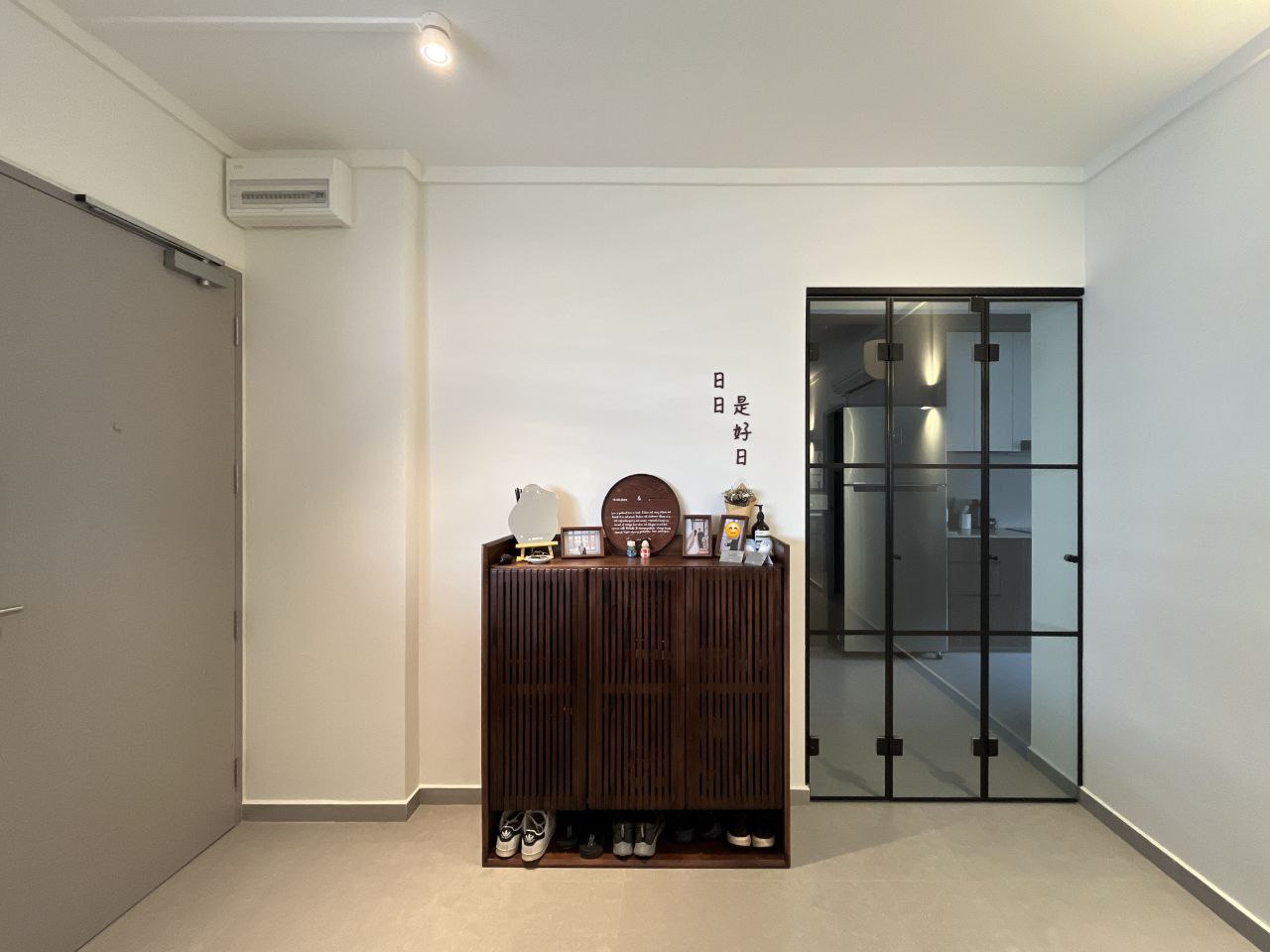 Sunset hues along our Entryway... a space for us to keep growing into - Wooden cabinet, indoor setting, modern decor