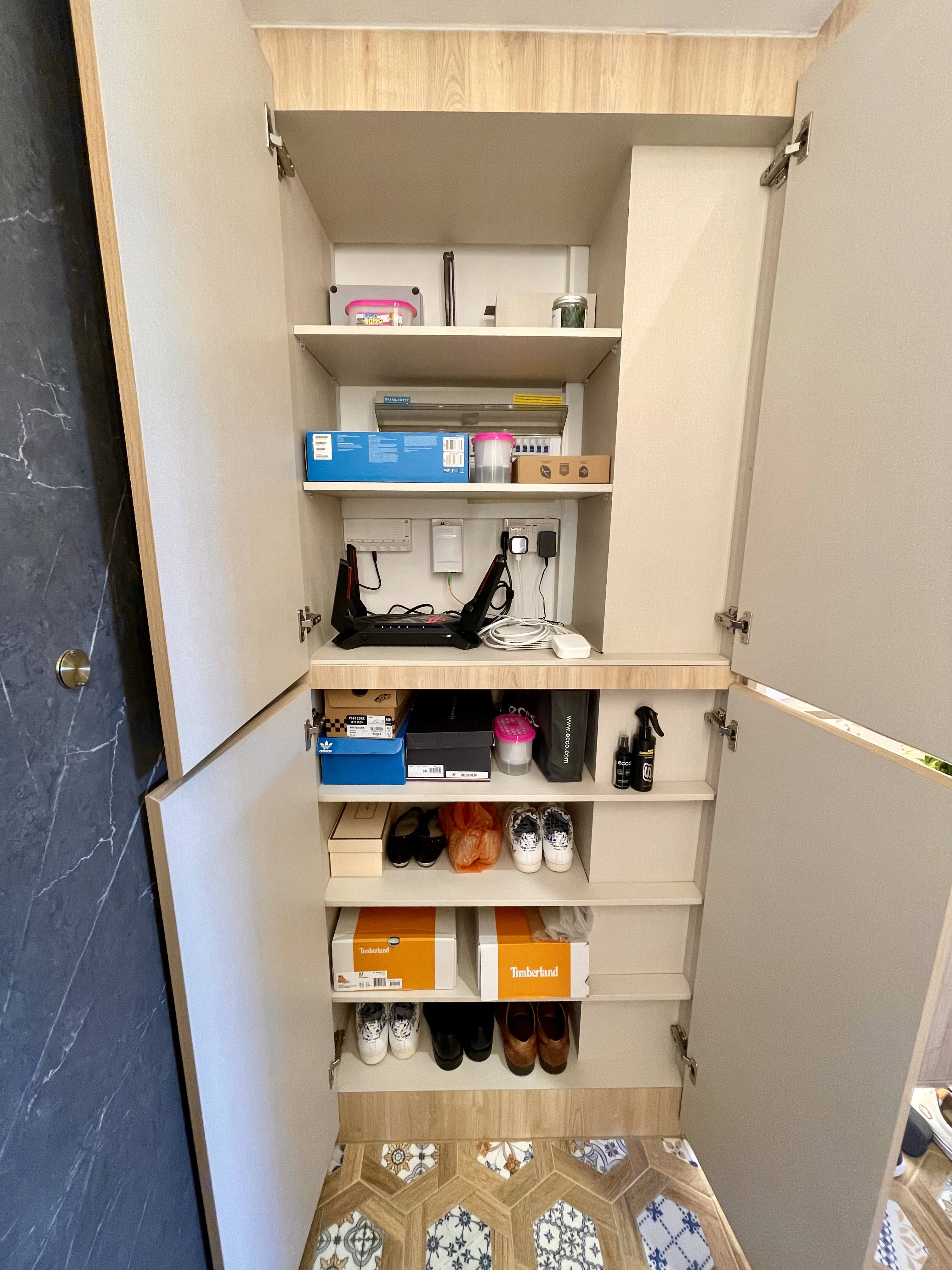 Our Entryway: An Amalgamation Of Peranakan Tiles & Tempered Glass Gate - Organized closet with neatly arranged shoes, socks