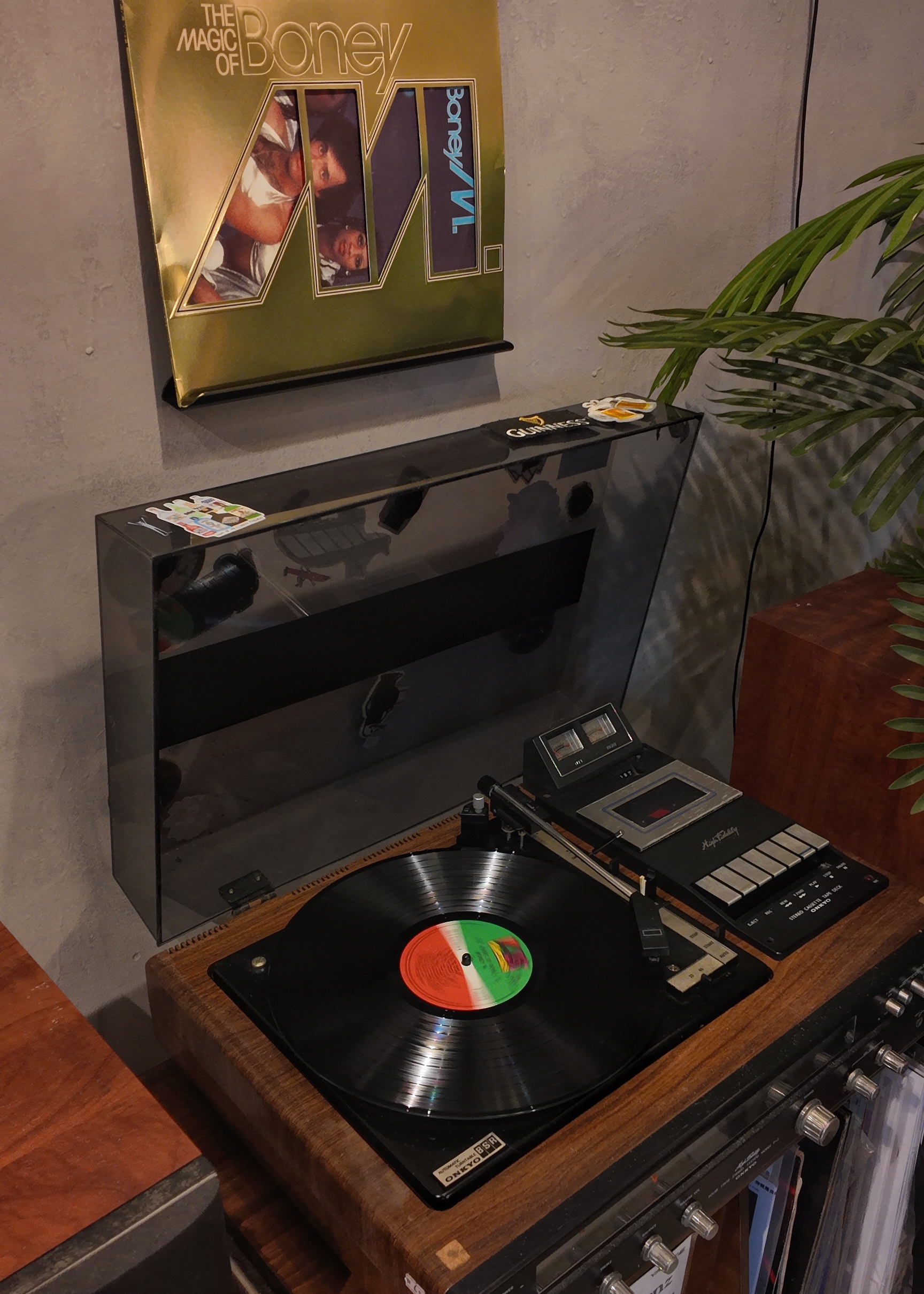 Enter this way folks! - Vinyl record on turntable, retro vinyl player, gold and black color scheme, glossy finish, black