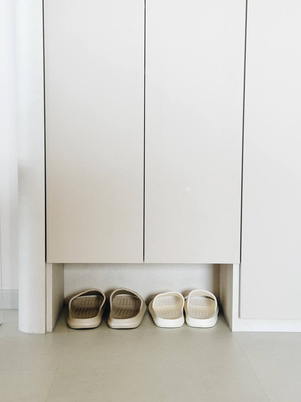 Our Entryway: Built-in shoe cabinet or not?  - White minimalist cabinet, beige slippers, clean, modern design, simple decor