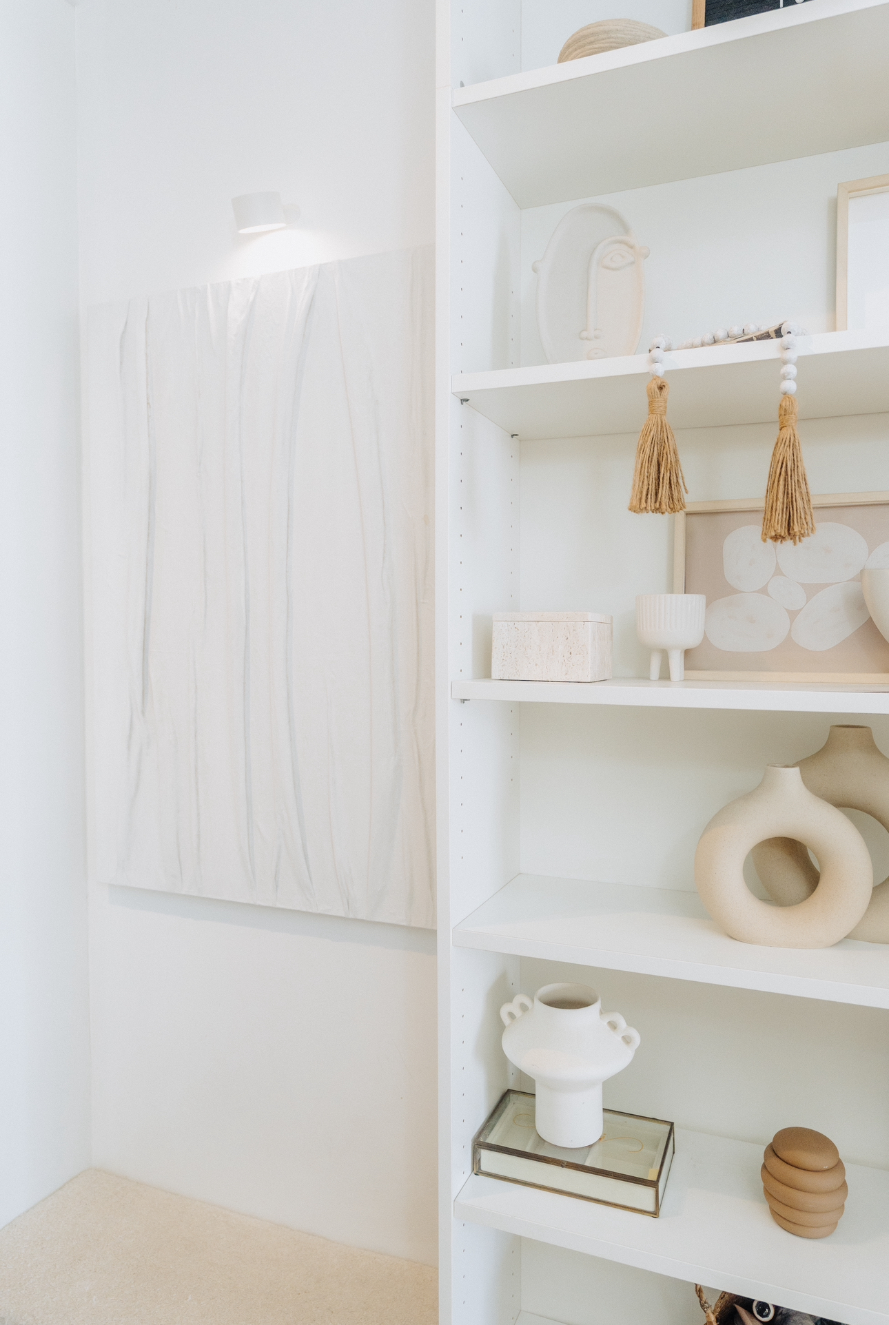 Our Entryway: Creating A Functional And Aesthetic Space With DIY  - White minimalist shelves, abstract art, natural fiber