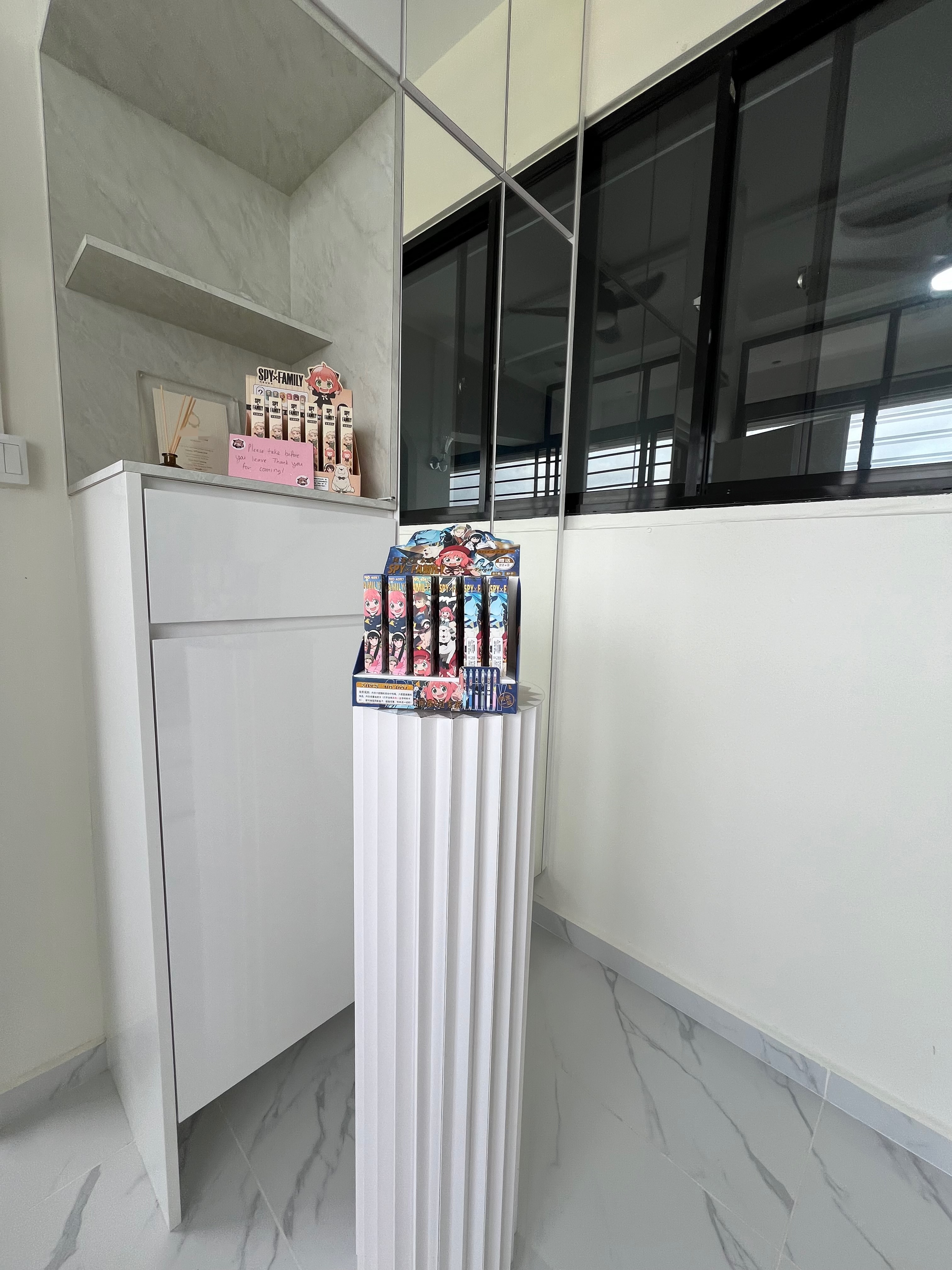 Entryway Evolution: From Hiccups to Highlights - Modern minimalist decor, white cabinet with marble accents, vertical ridged