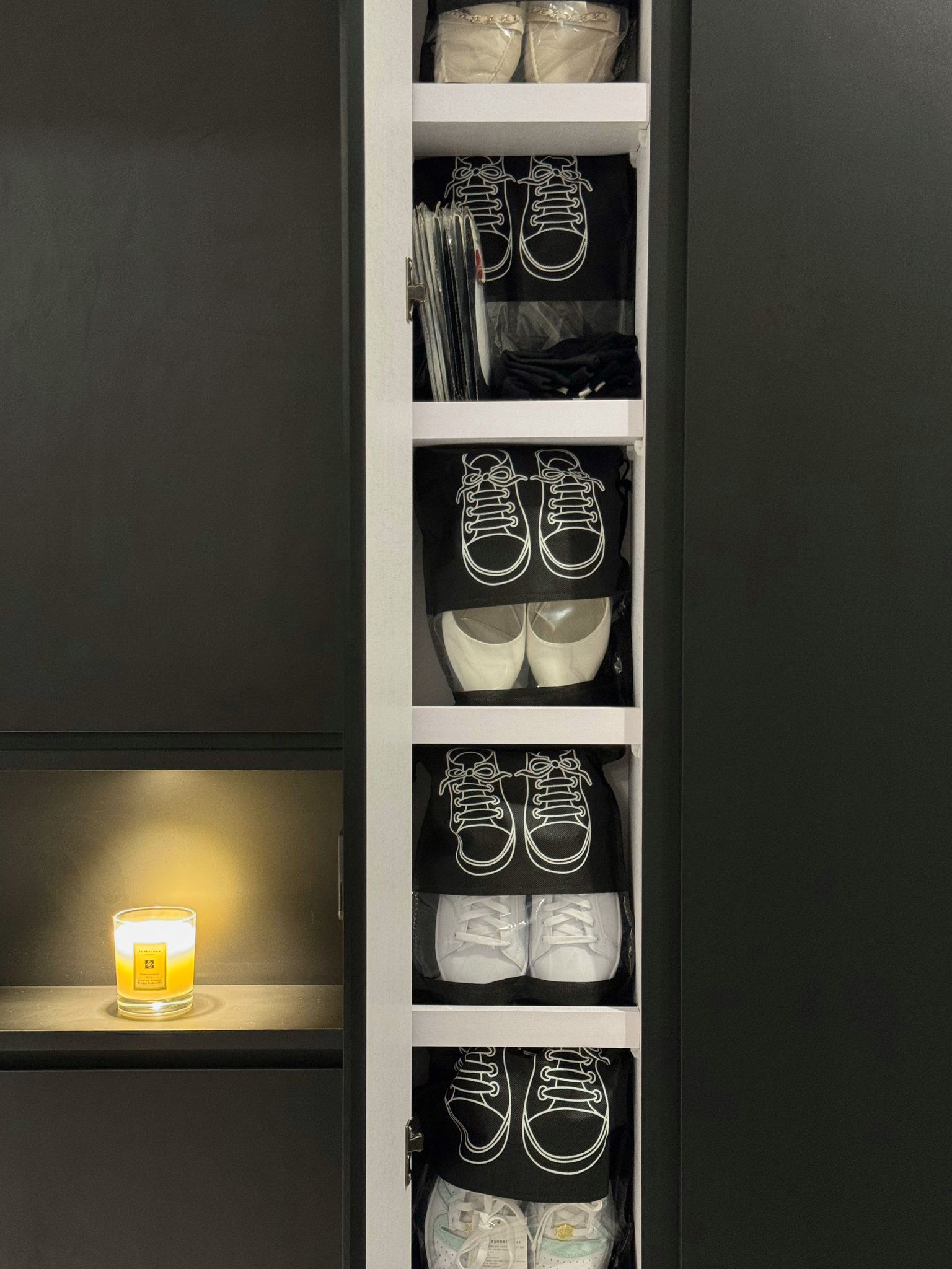 Our Entryway: Homecoming Edition! - Shoes, closet, organized, white sneakers, black shoes, candle, dim lighting, minimalist