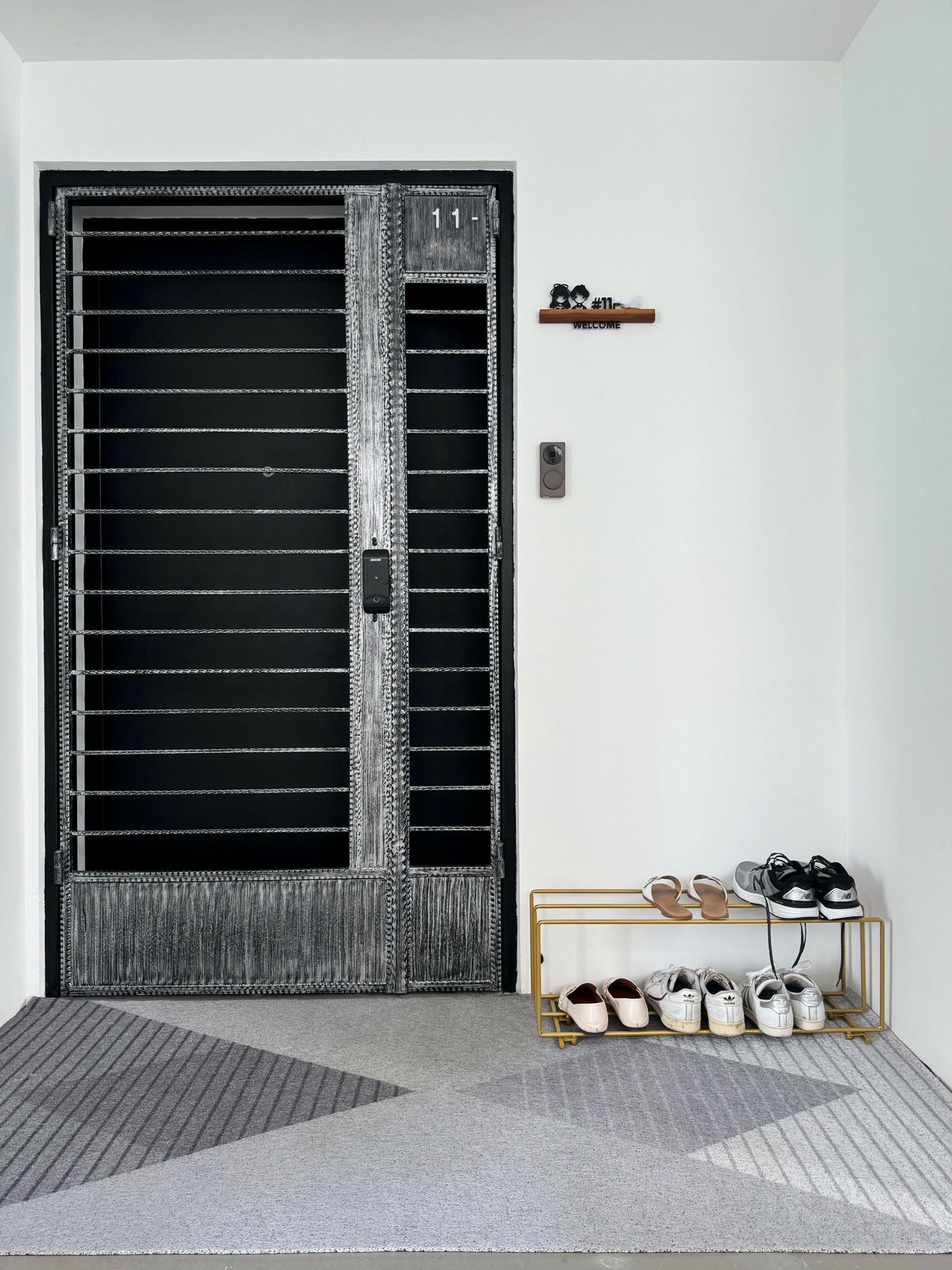 Our Entryway: Homecoming Edition! - Sleek, modern design with a black and white color scheme, Black metal doors with