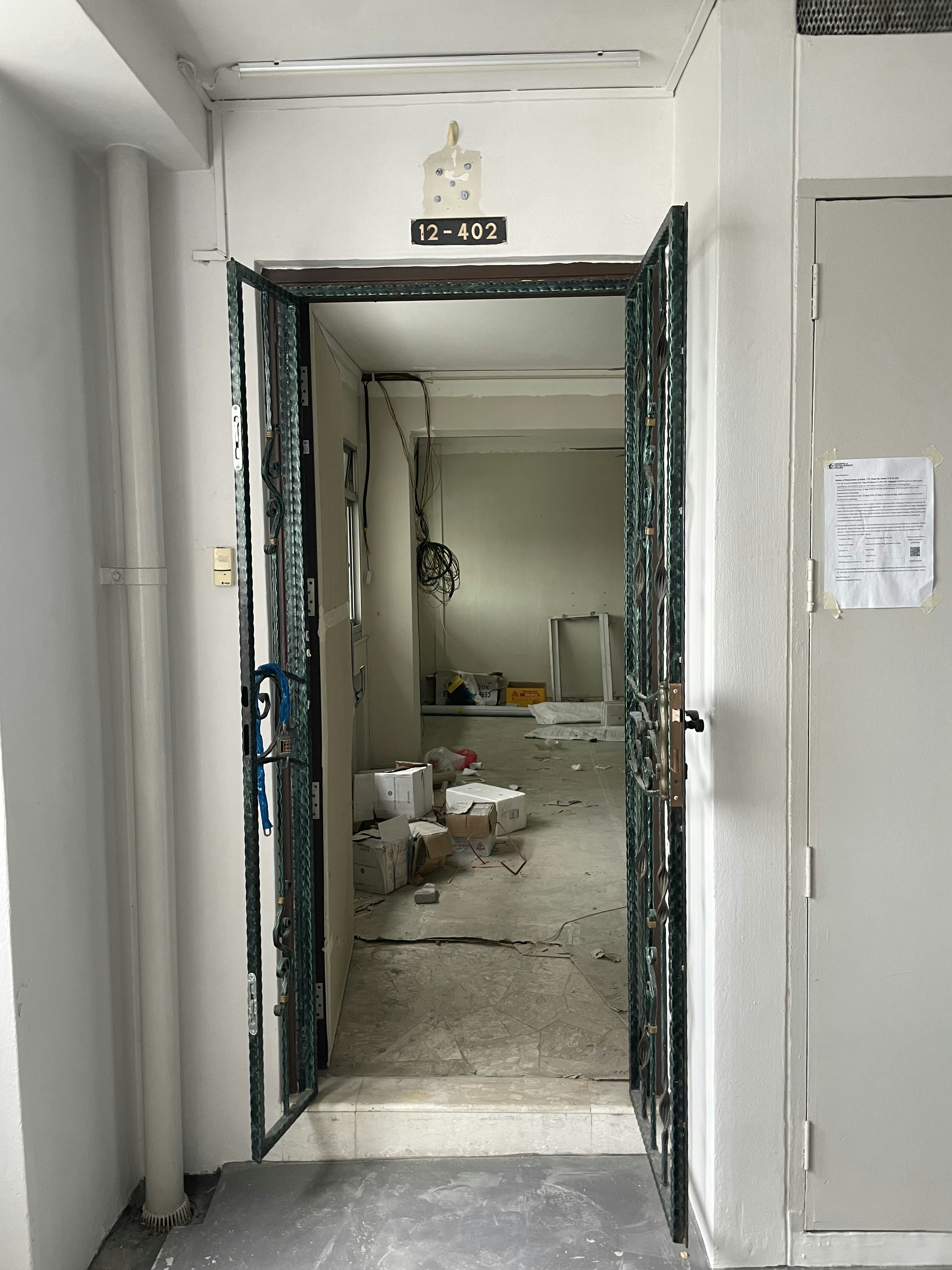 Entryway Meets DIY Balcony: Our Personalized Welcome Space - Interior view of a room with an open door leading to a cluttered