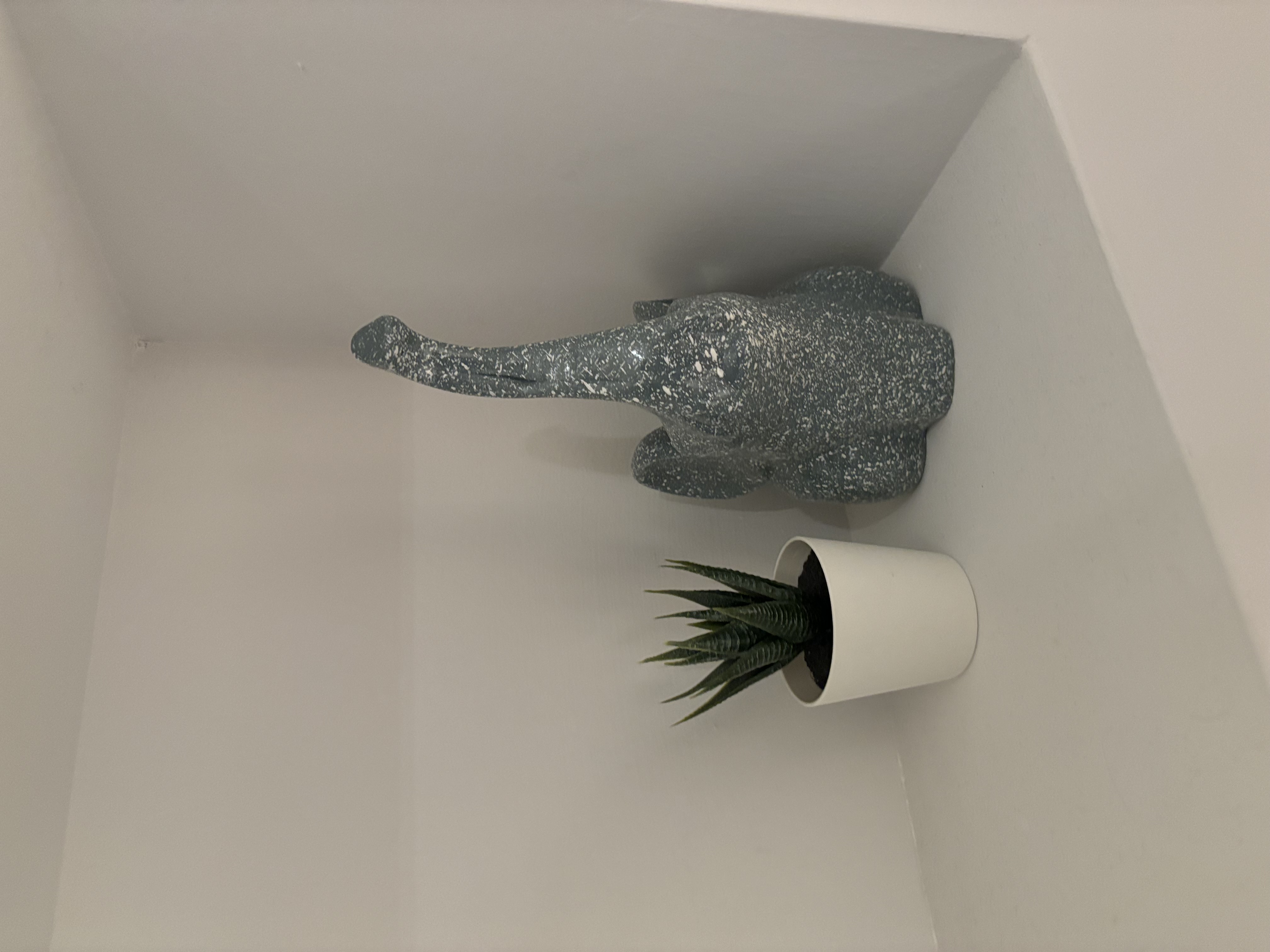 Inviting Entryway with a Cozy Niche Wall and Warm Wood-Toned Settee - Elegant, minimalist, modern, artistic, decorative