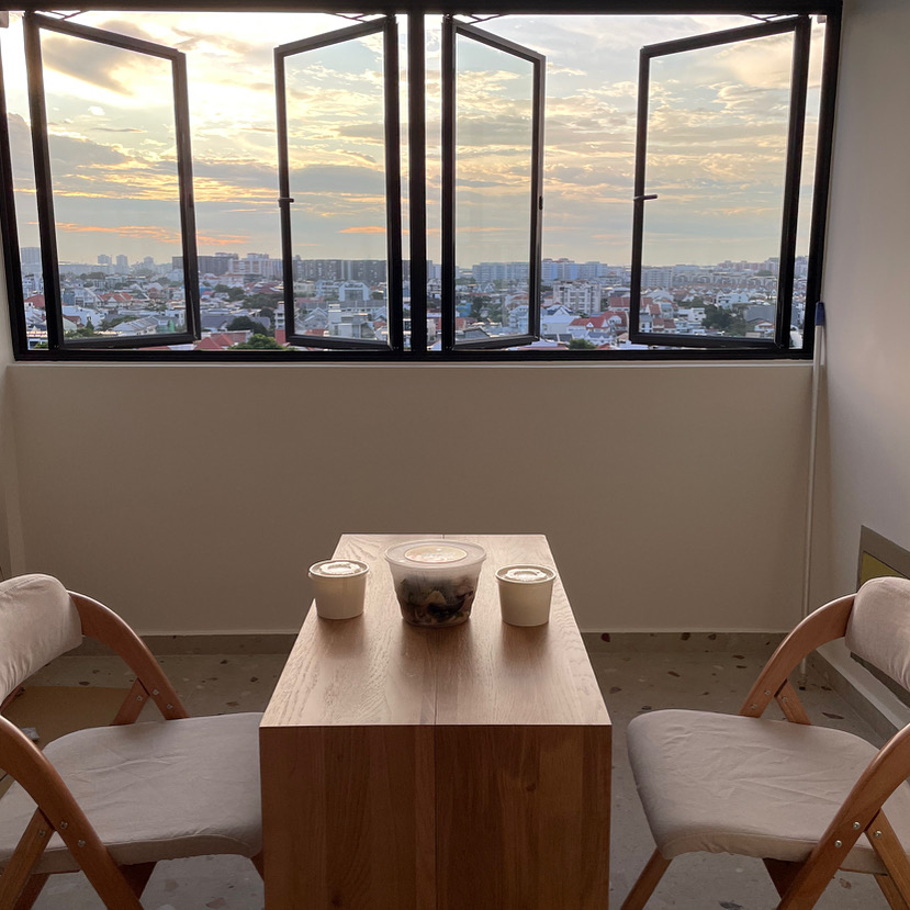 Dining & Hosting, Times Three: A Home Built for Connection - Sunset view from a modern apartment, large windows with black