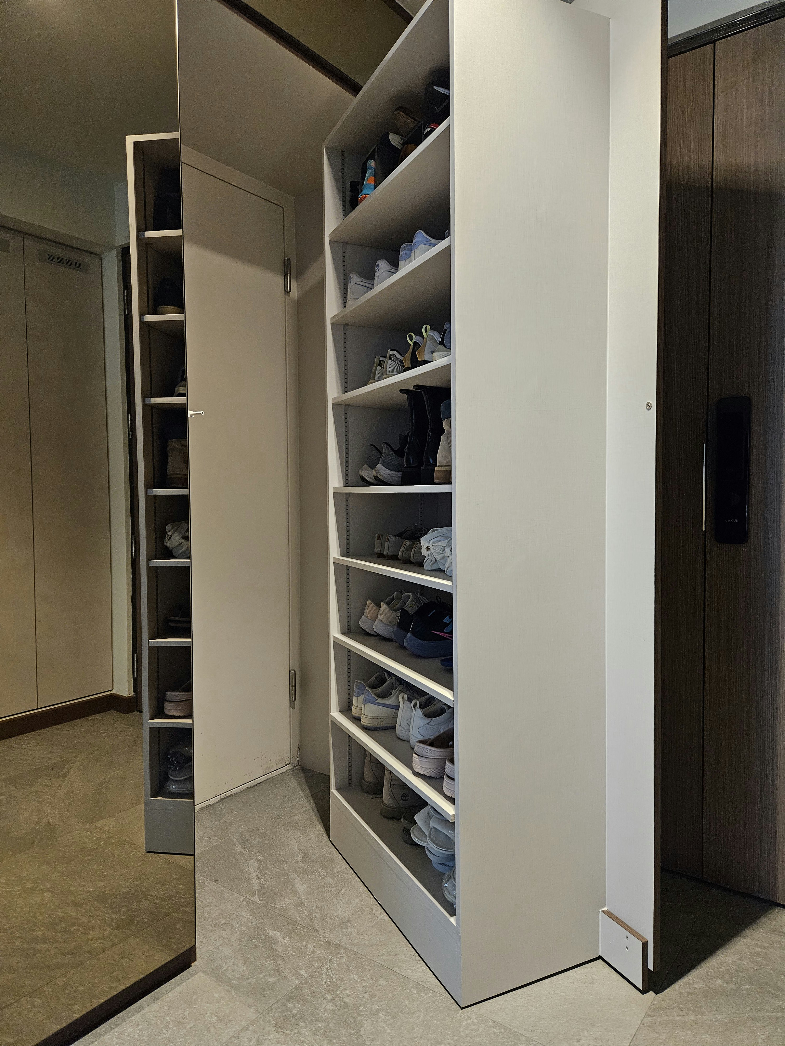 Our Foyer Is Also Our Storeroom - Shelf with neatly arranged shoes, closet with open doors, minimalist interior design