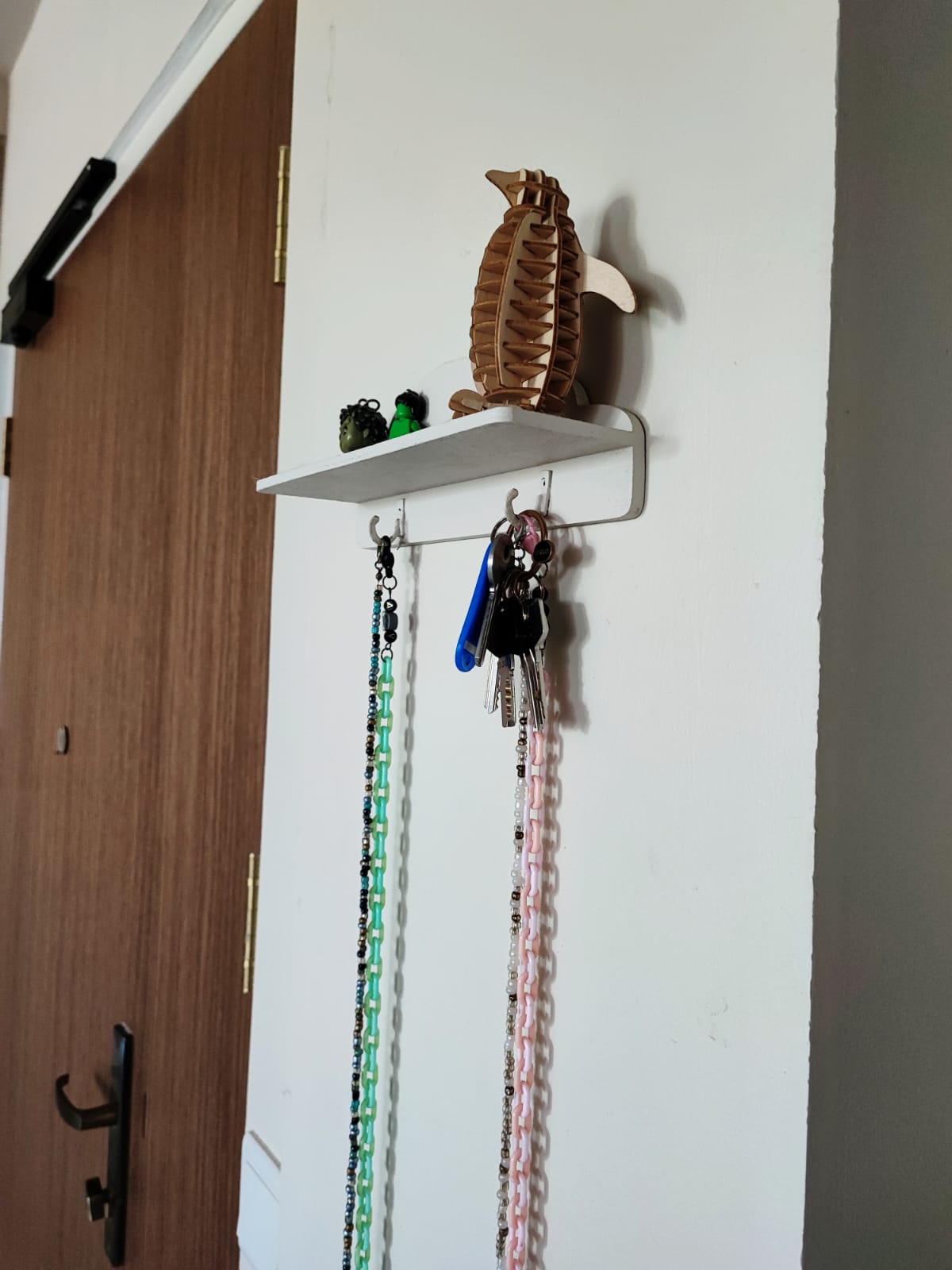 A functional entryway - Using paint to conceal unsightly areas! - Wooden shelf, key holder, hanging keys, colorful beads