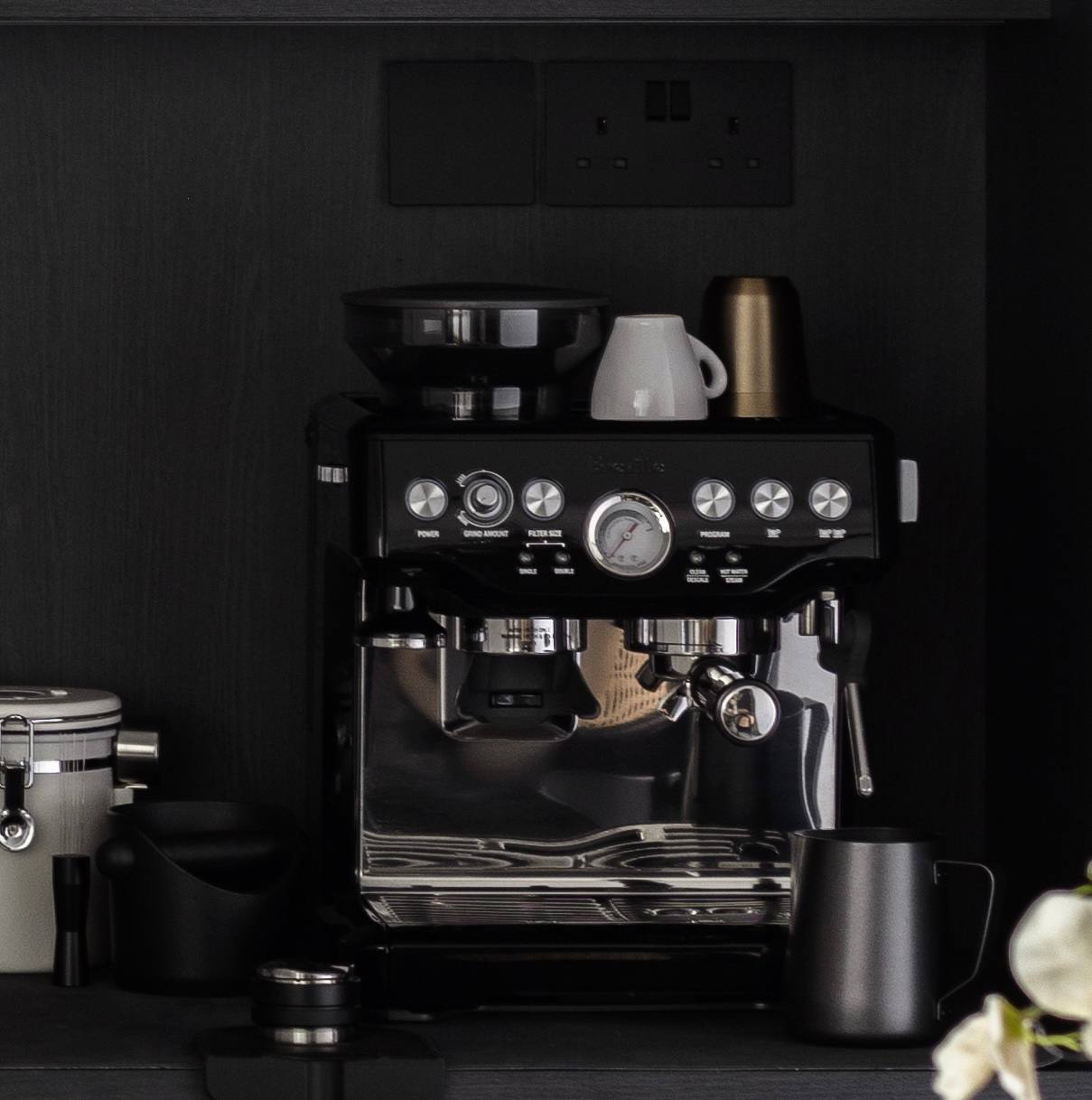 Hidden in plain sight - can you spot the hidden elements in our home? - black coffee machine, sleek design, modern kitchen