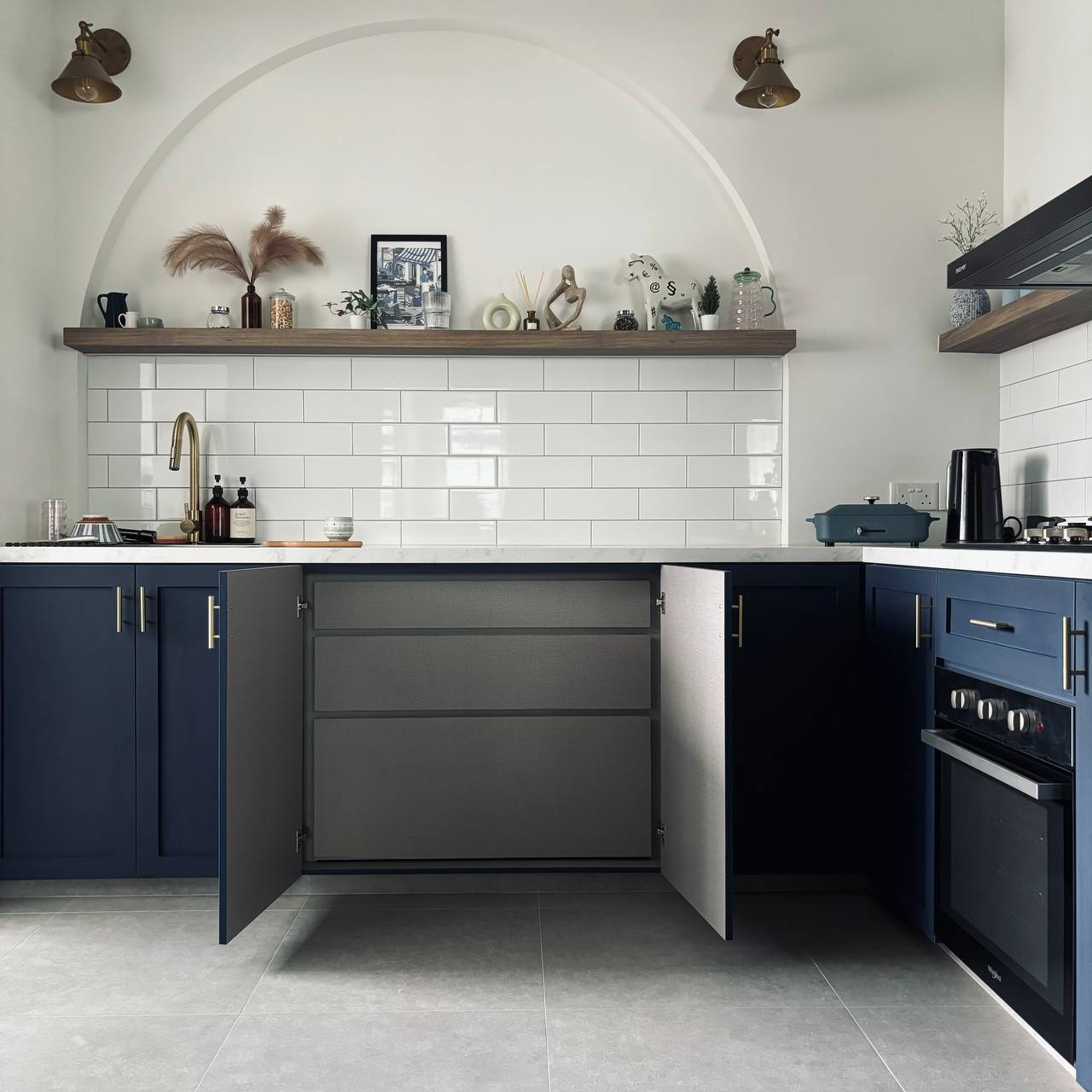 Hidden in plain sight - can you spot the hidden elements in our home? - White tiled backsplash, dark blue cabinets, gold