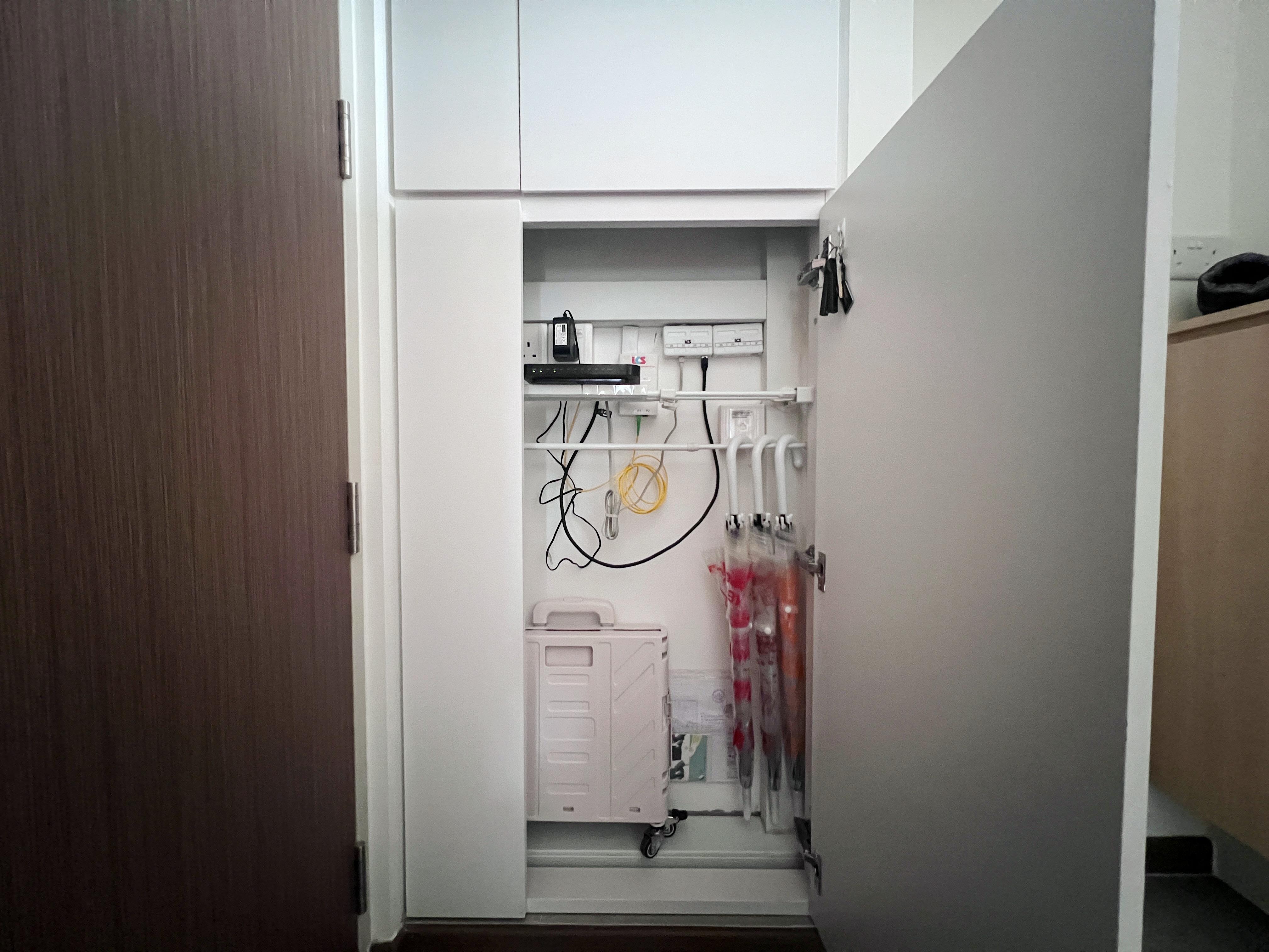 A simple & functional entryway with built in settee - Utility cabinet, electrical panel, cables, devices, organized space