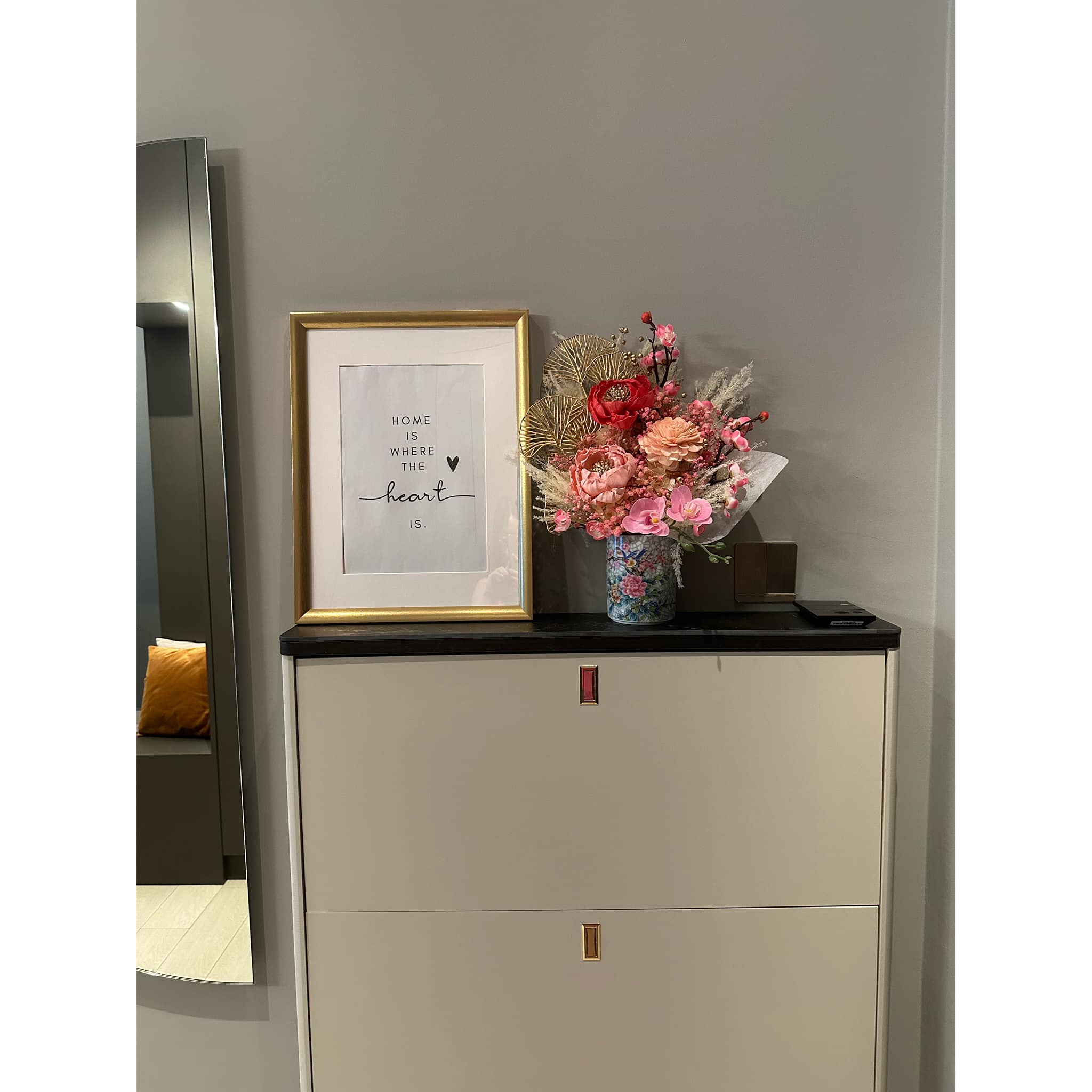 A Stylish Welcome: Sleek, Spacious and Shoe-Friendly - vibrant floral arrangement, elegant vase, pink flowers, red rose, gold