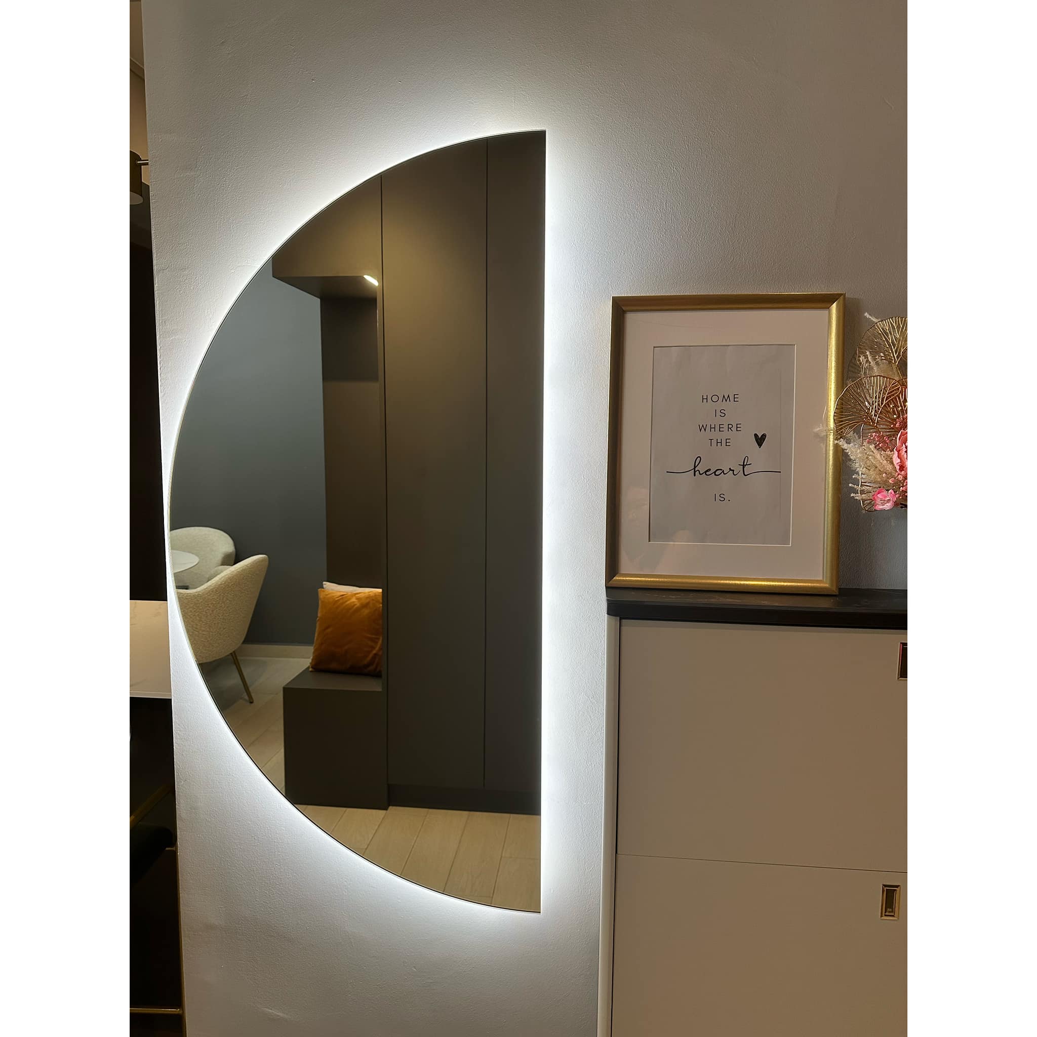 A Stylish Welcome: Sleek, Spacious and Shoe-Friendly - Modern minimalist interior, sleek white wall, illuminated oval shape