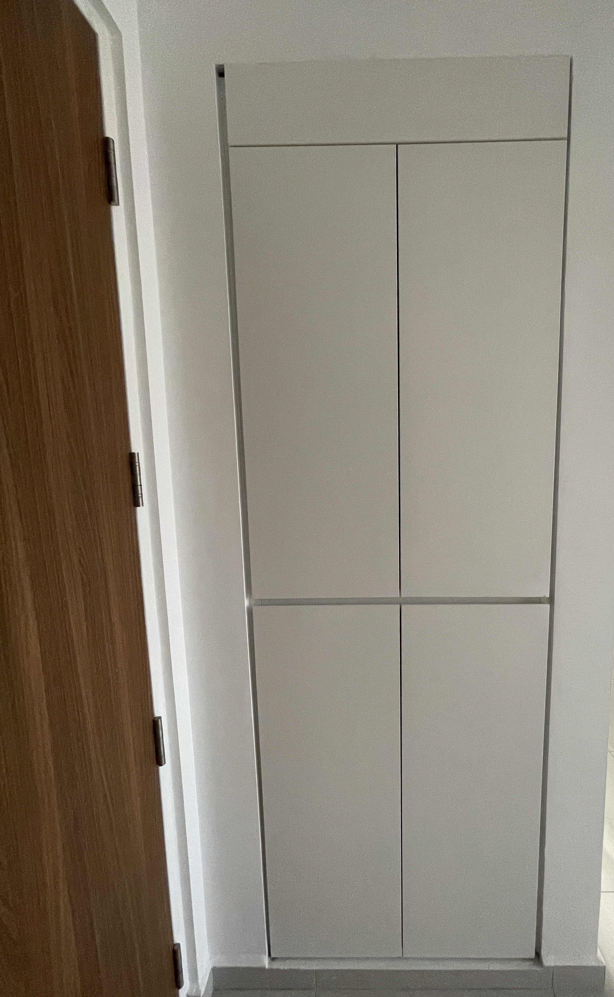 Inviting-Entryway:-Concealed-Bomb-Shelter-and-Shoe-Storage