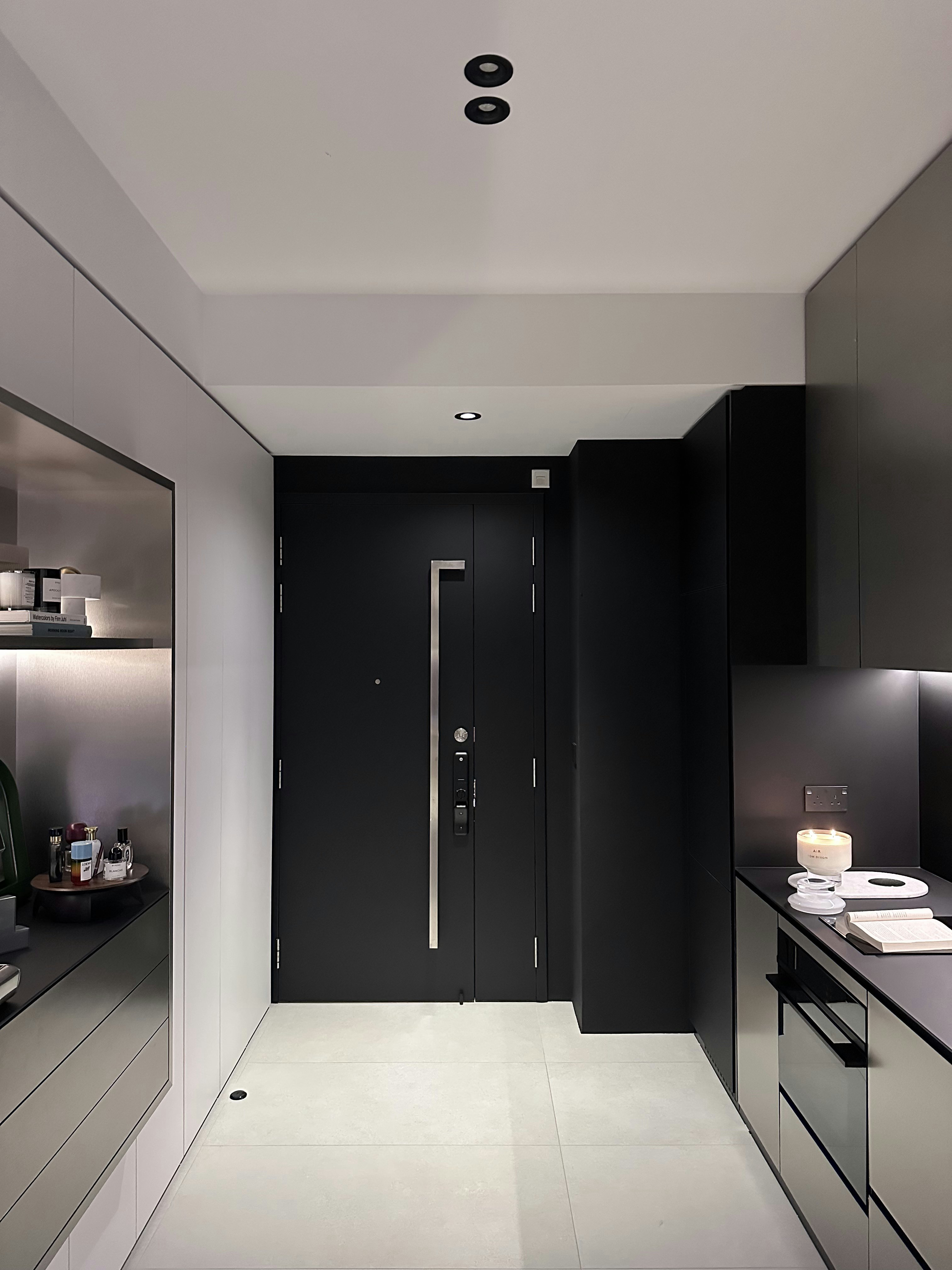 A Seamless Welcome: Introducing Our Stylish Entryway - Modern minimalist kitchen, sleek black cabinets, contemporary design