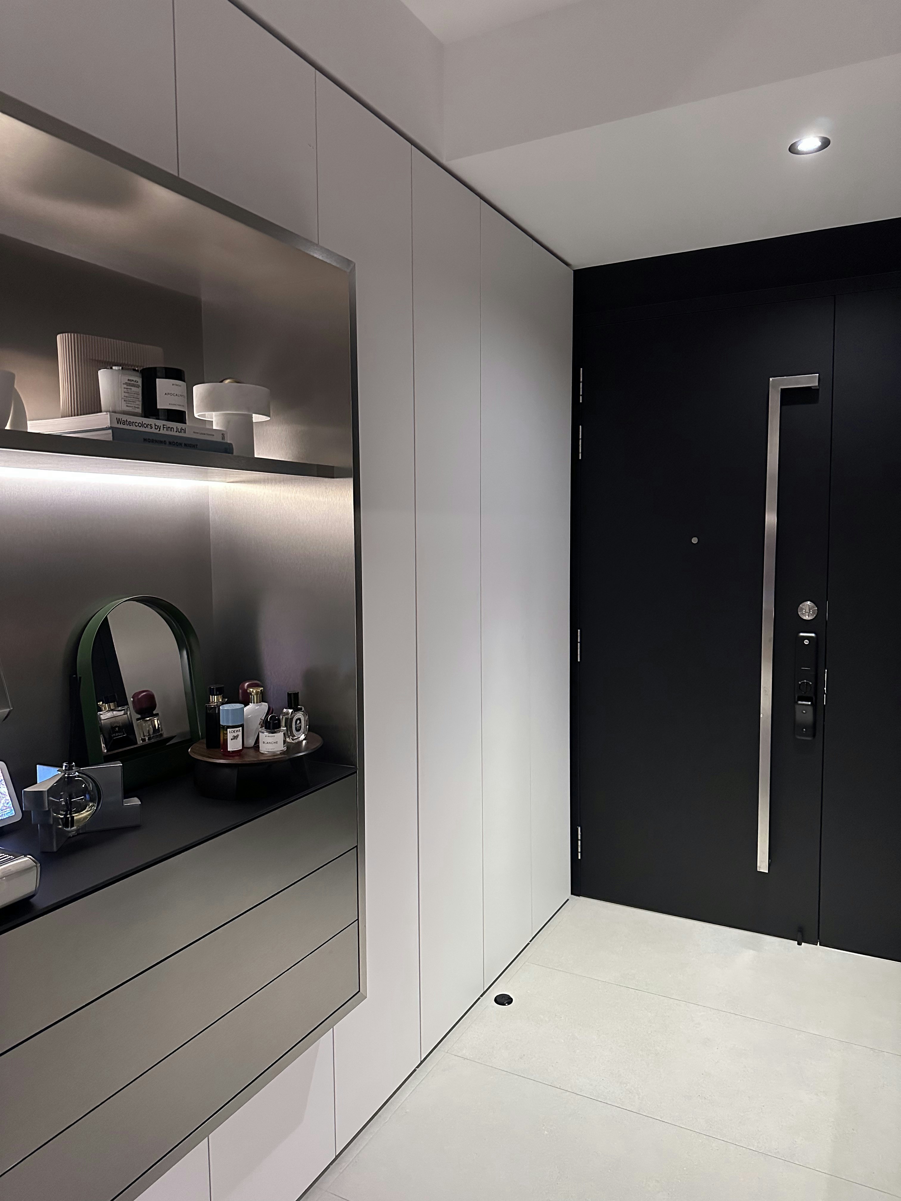 A Seamless Welcome: Introducing Our Stylish Entryway - Modern minimalist bathroom, sleek cabinets, illuminated shelves