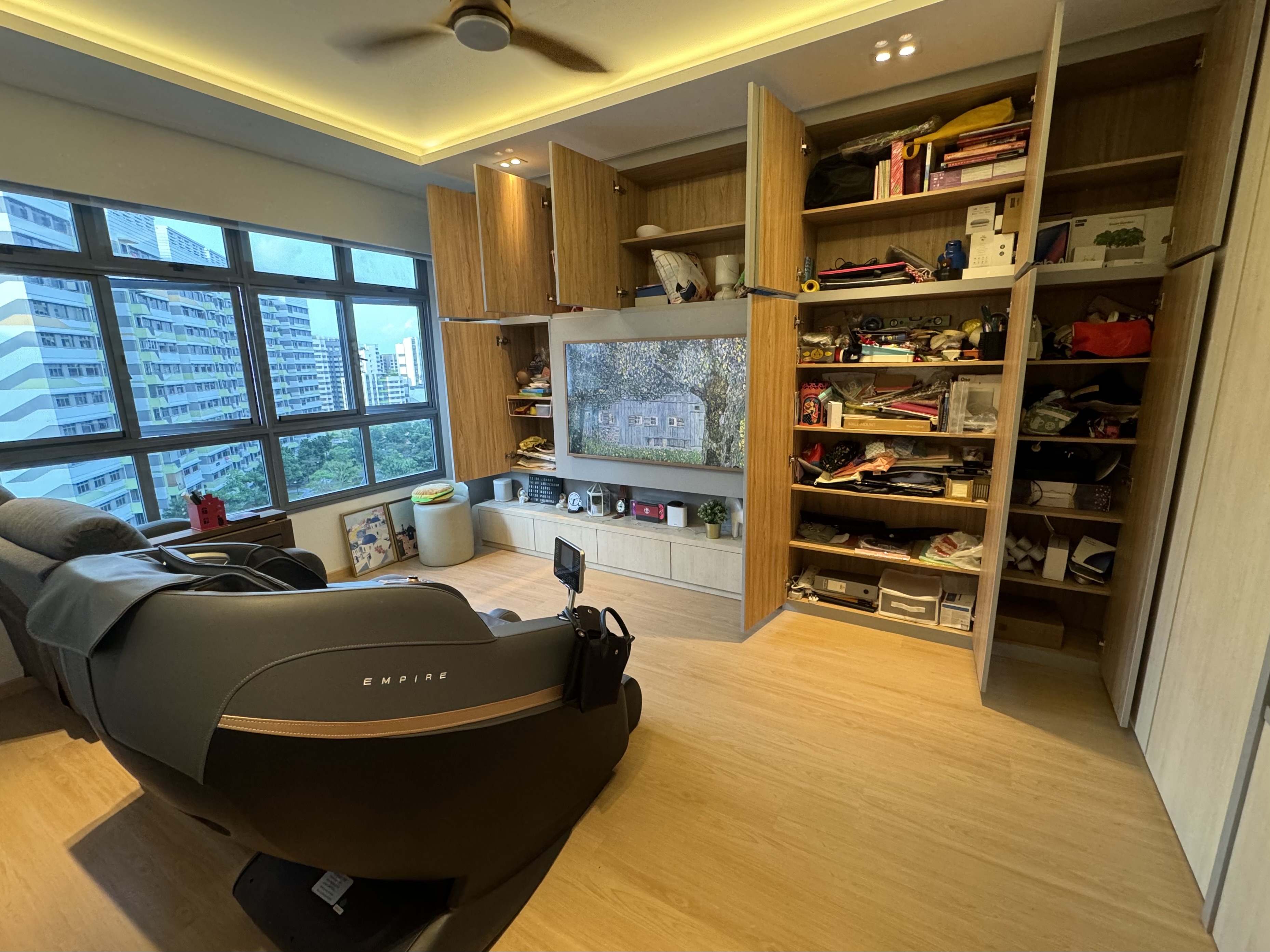 Peek-A-Boo Spaces to Maximise 93sqm - Modern living room with large windows, wooden cabinets, entertainment center, black