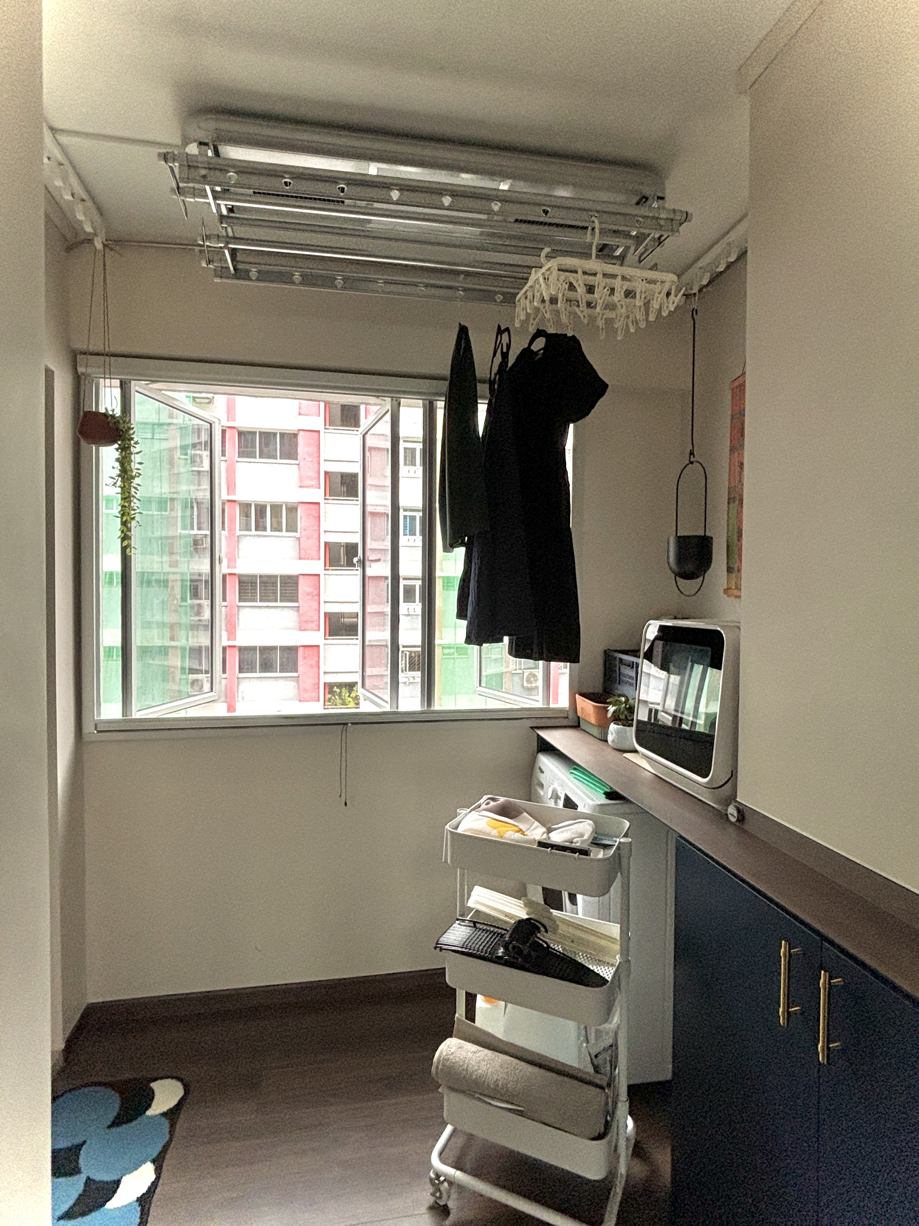 A peek into our Sunday at home - Mini kitchen, compact living space, laundry area, clothes rack, hanging clothes, indoor