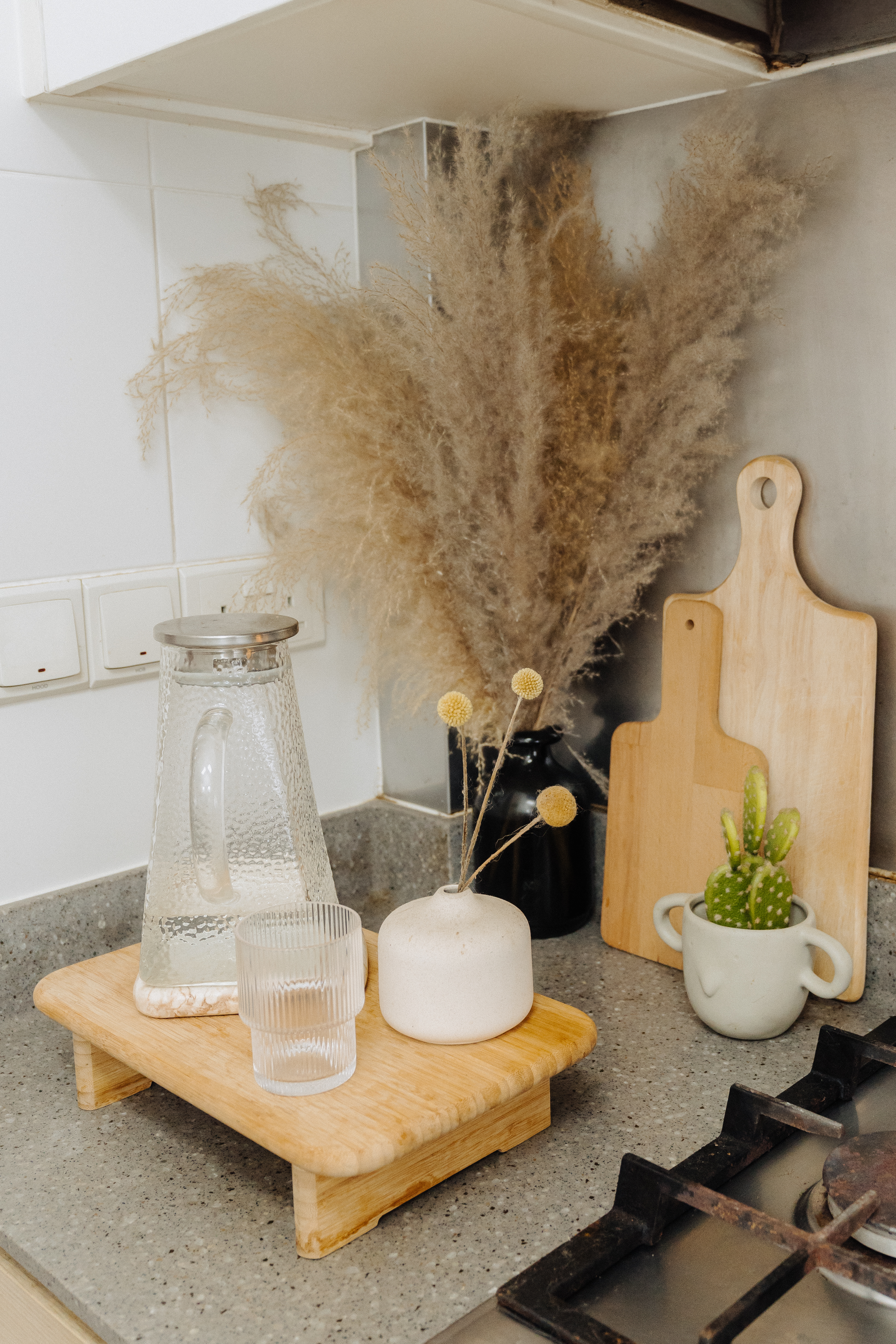 Our Standard Kitchen That Came With Our DBSS: How We Live With It - Clear glass pitcher, white ceramic mug, wooden cutting