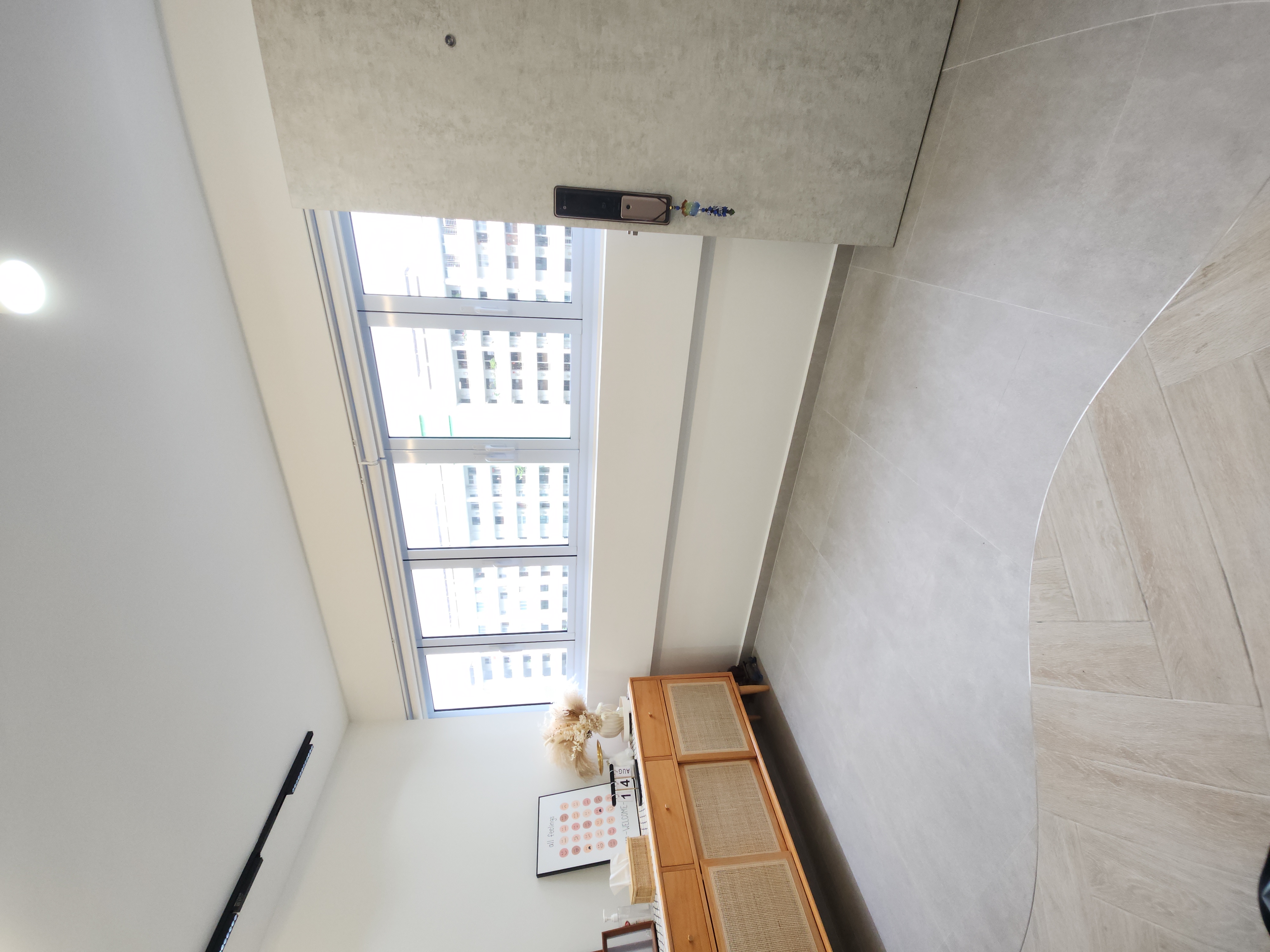 No build-ins for our Entryway - Modern minimalist interior, large window, bright daylight, white ceiling, light gray walls