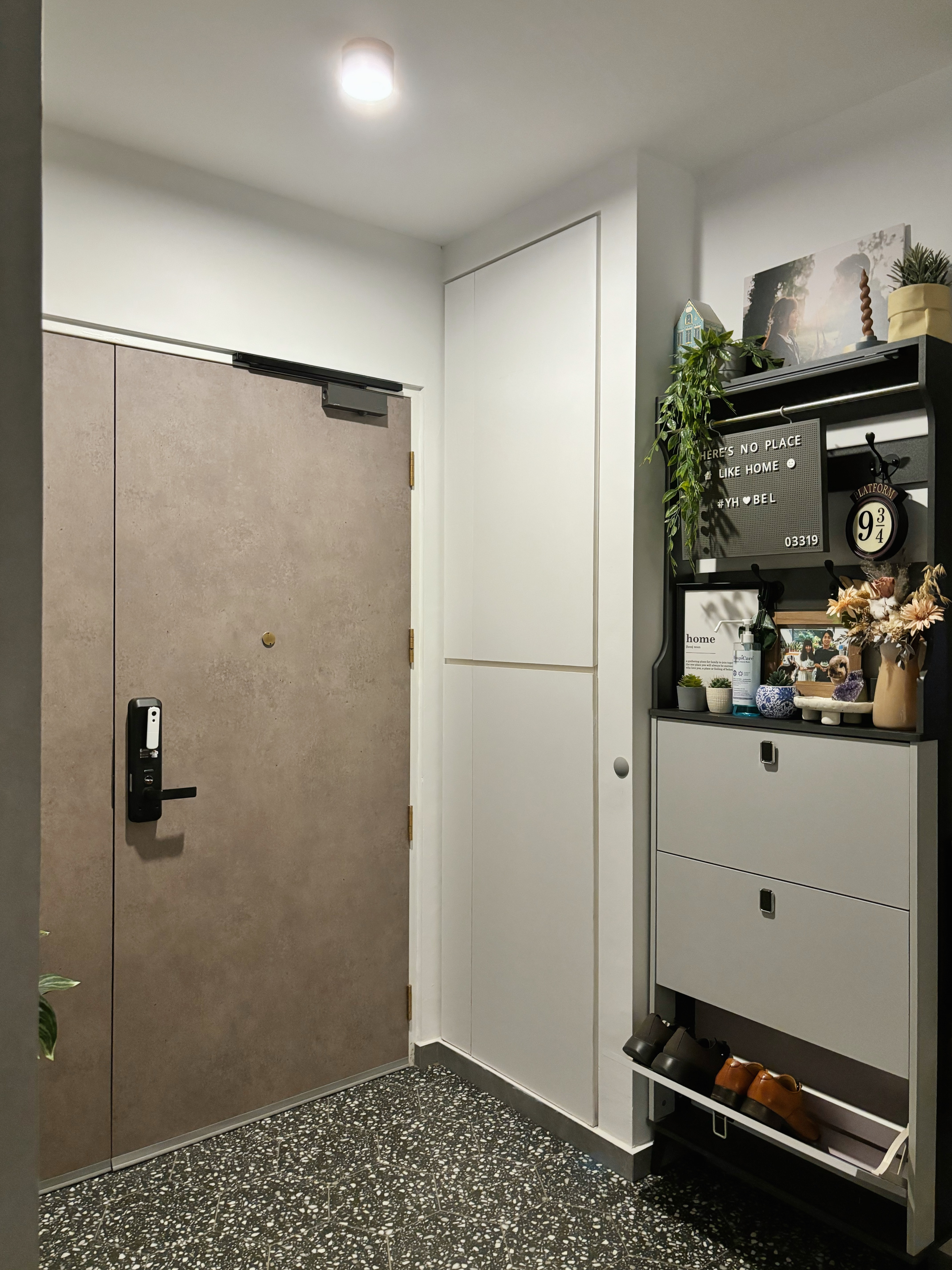 Knock Knock! Who’s There? Potterhome’s Welcoming Entryway - modern entryway, minimalist design, sleek door, white walls, gray