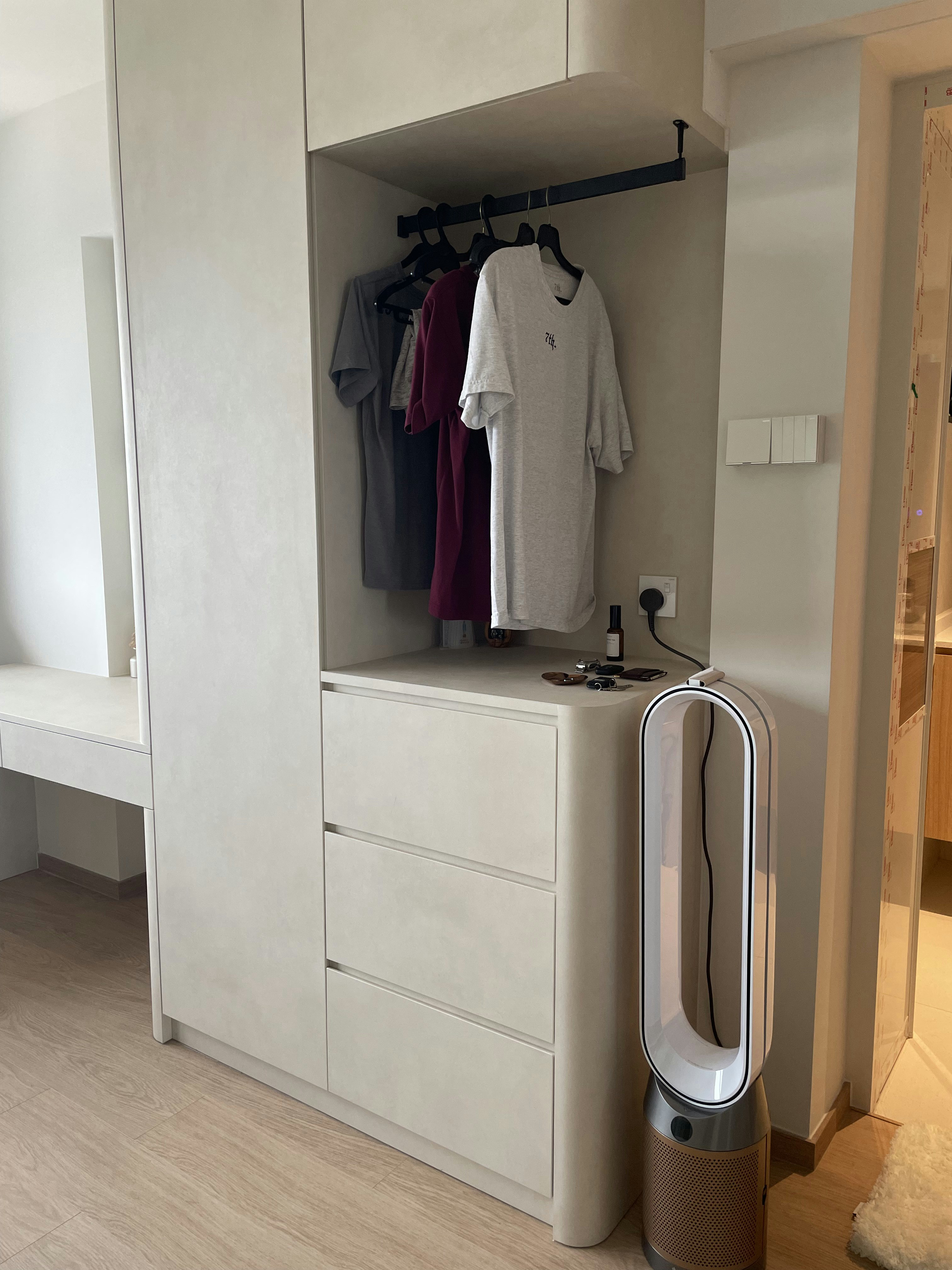 A Retreat for Rest: Our TV-Free Bedroom Sanctuary - Modern minimalist wardrobe with white cabinets, neatly hung clothes in