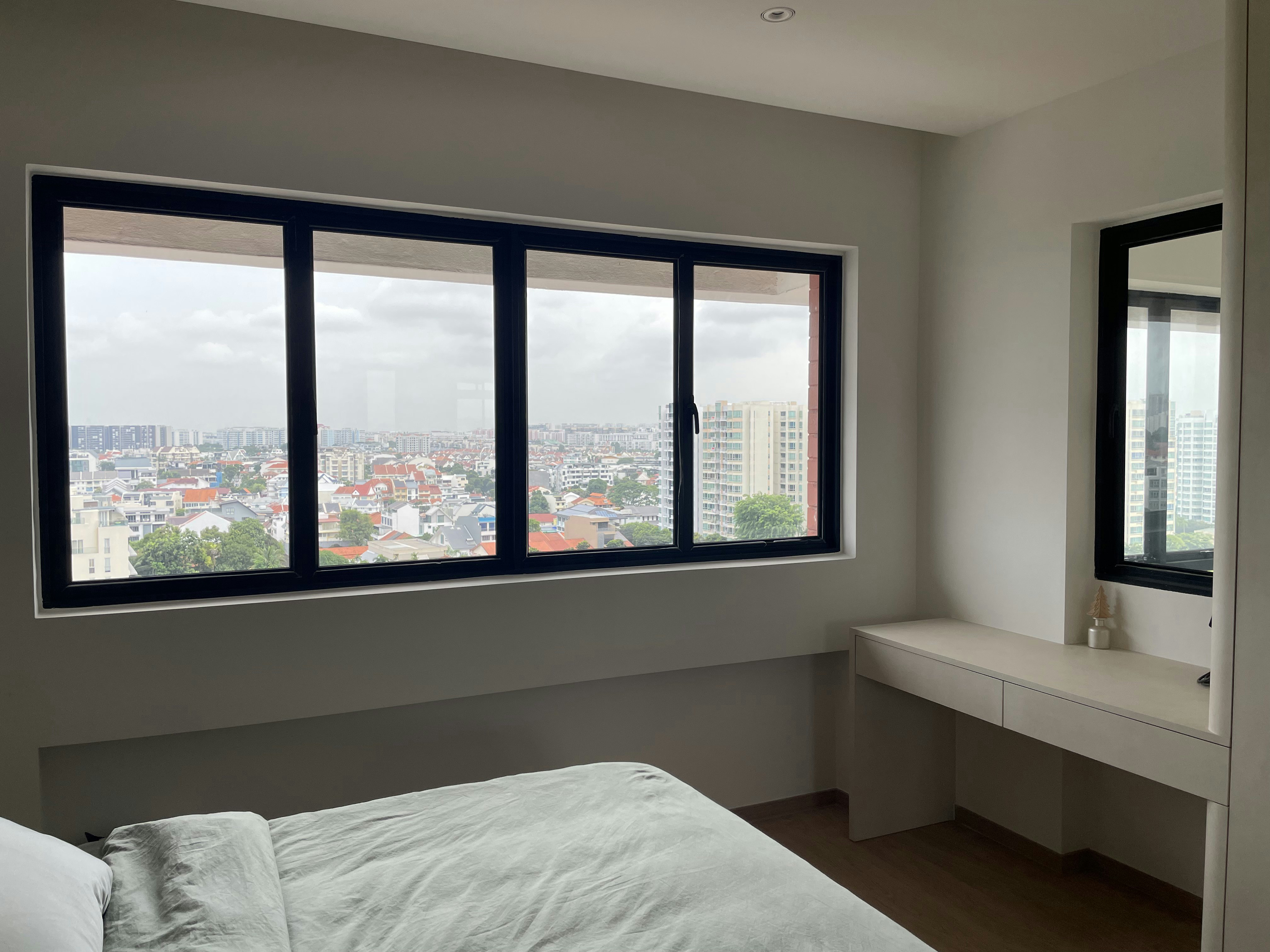 A Retreat for Rest: Our TV-Free Bedroom Sanctuary - Modern bedroom with large window, cityscape view, neutral color palette