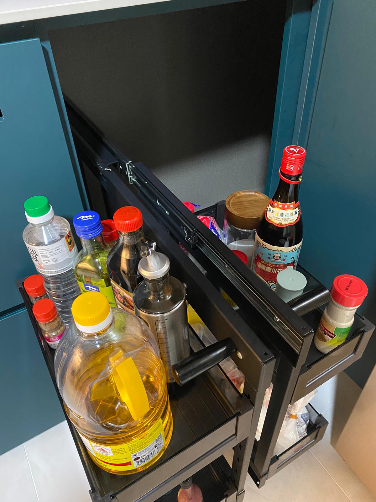 Self-designed Kitchen: how we make a small space work - large bottle of cooking oil, red and yellow bottles, clear plastic
