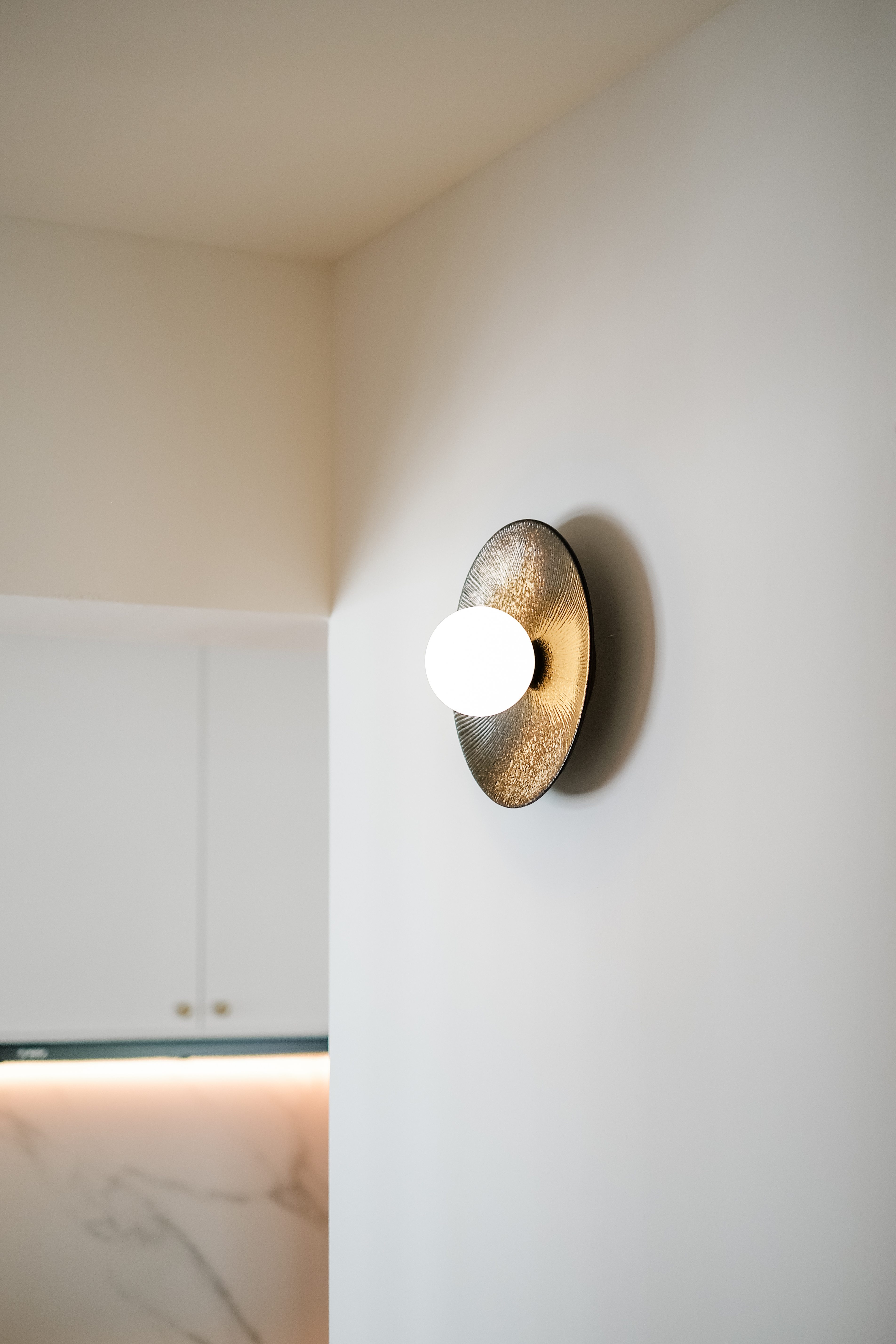 How a Big Pillar Couldn't Stop My Dream of a Large Kitchen Island - Modern wall-mounted light fixture, minimalist design