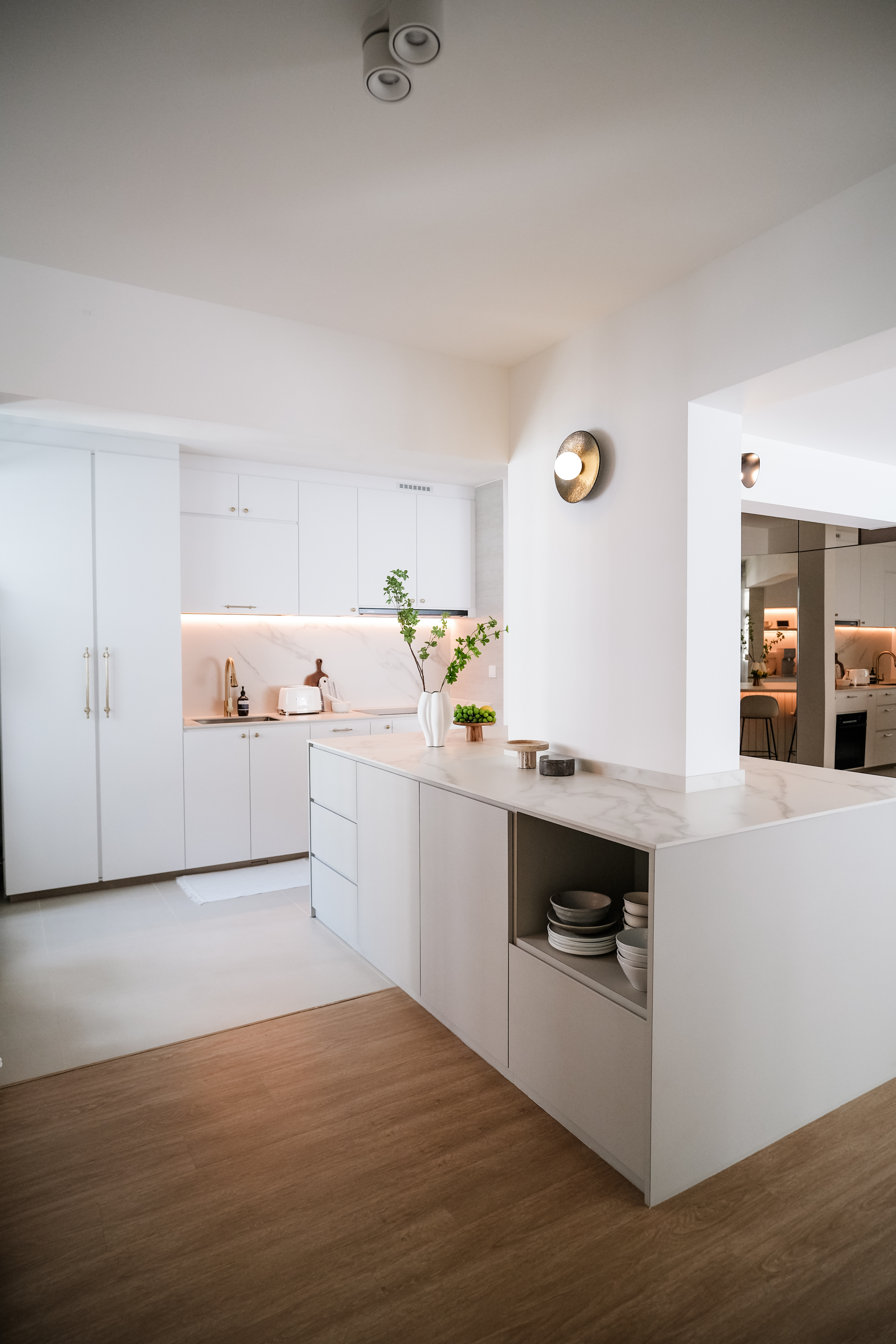 How a Big Pillar Couldn't Stop My Dream of a Large Kitchen Island - modern kitchen, minimalist design, sleek cabinetry, white