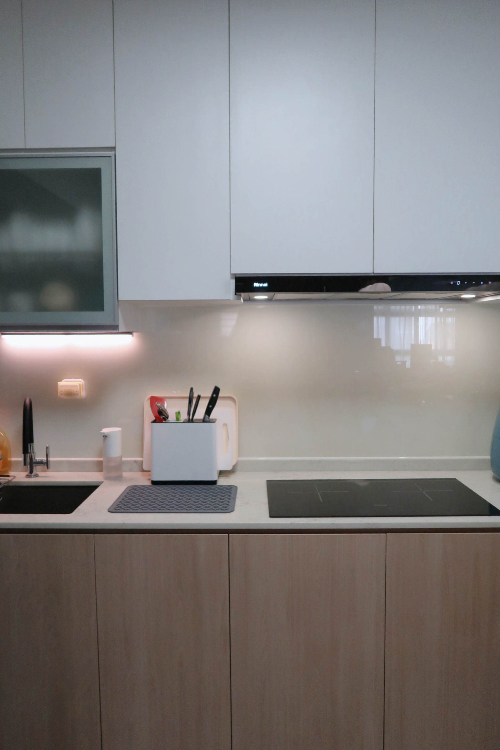 Whisking up a storm in the kitchen 🍽️ - White kitchen cabinets, modern backsplash, stainless steel range hood, black faucet