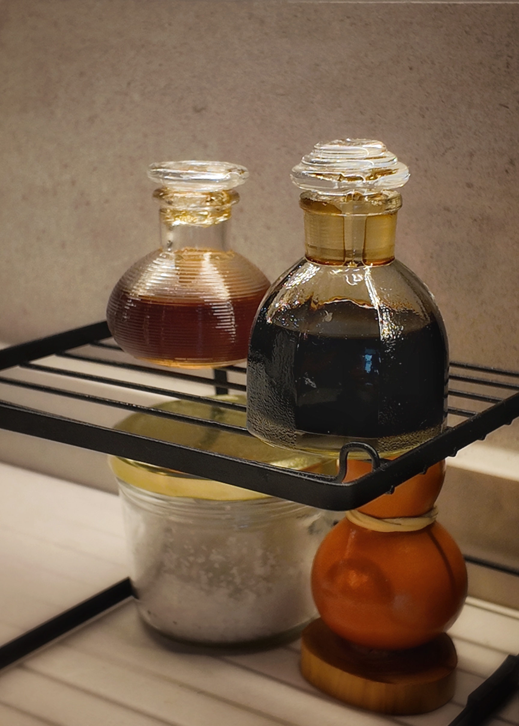 This is where food babies are made - glass bottles, amber liquid, dark liquid, amber glass, clear glass, transparent bottles