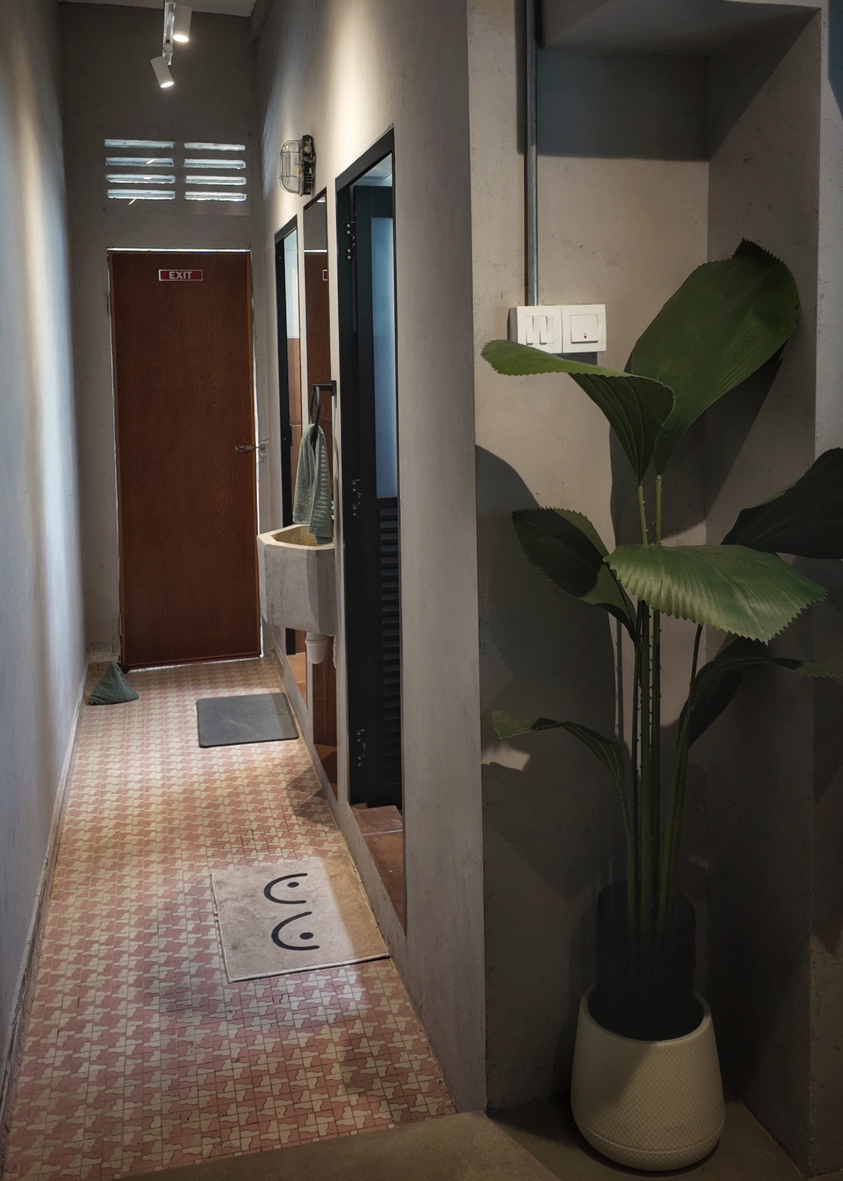 No funny monkey business here! - modern bathroom hallway, minimalist design, cozy atmosphere, tiled floor, wooden door, green