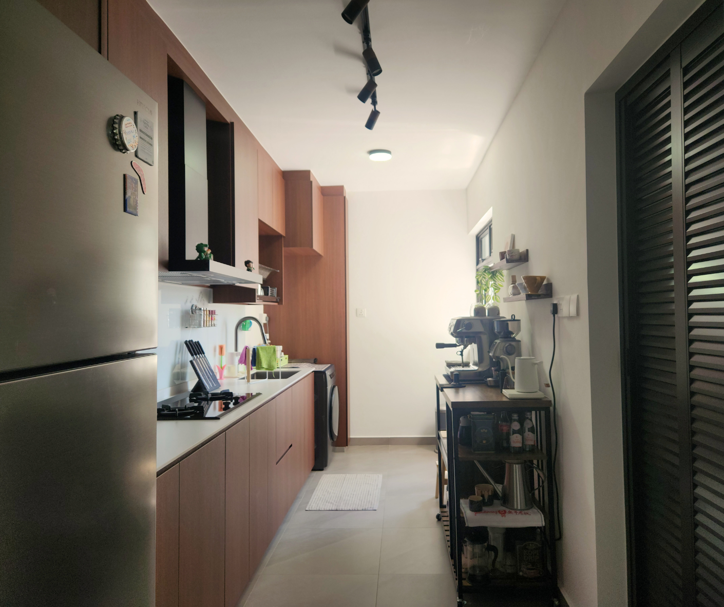 Reimagining Our Kitchen: A Year of Transformation and Our Best Tips - Modern kitchen with stainless steel refrigerator