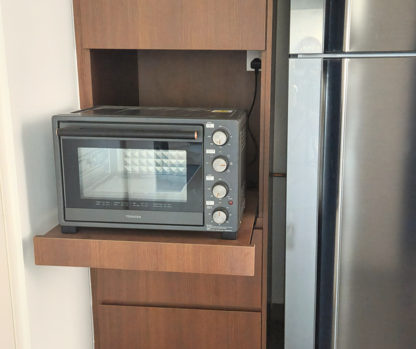 Reimagining Our Kitchen: A Year of Transformation and Our Best Tips - Wooden kitchen cabinet, microwave oven, black and