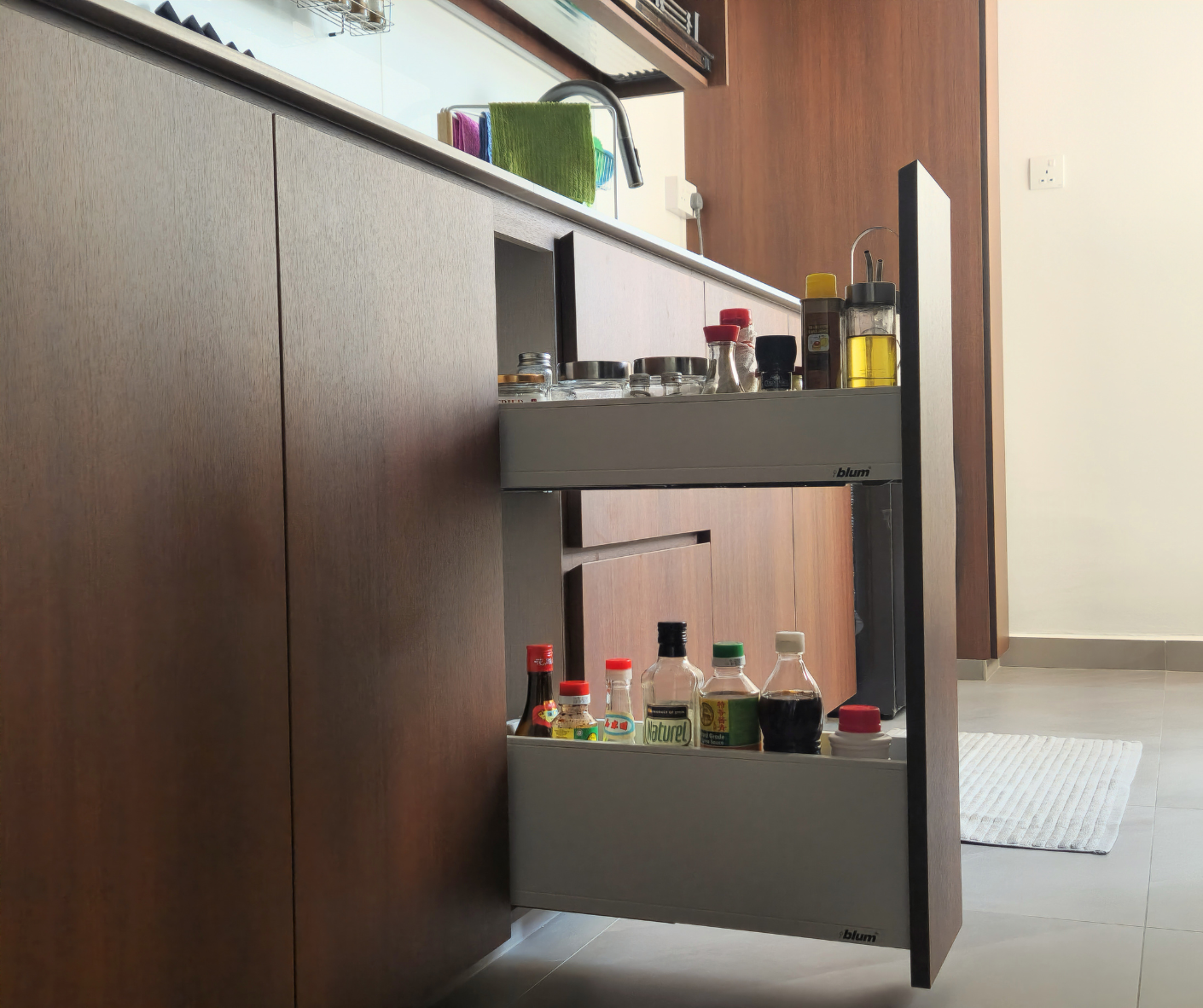 Reimagining Our Kitchen: A Year of Transformation and Our Best Tips - Wooden kitchen cabinets, white countertop, colorful