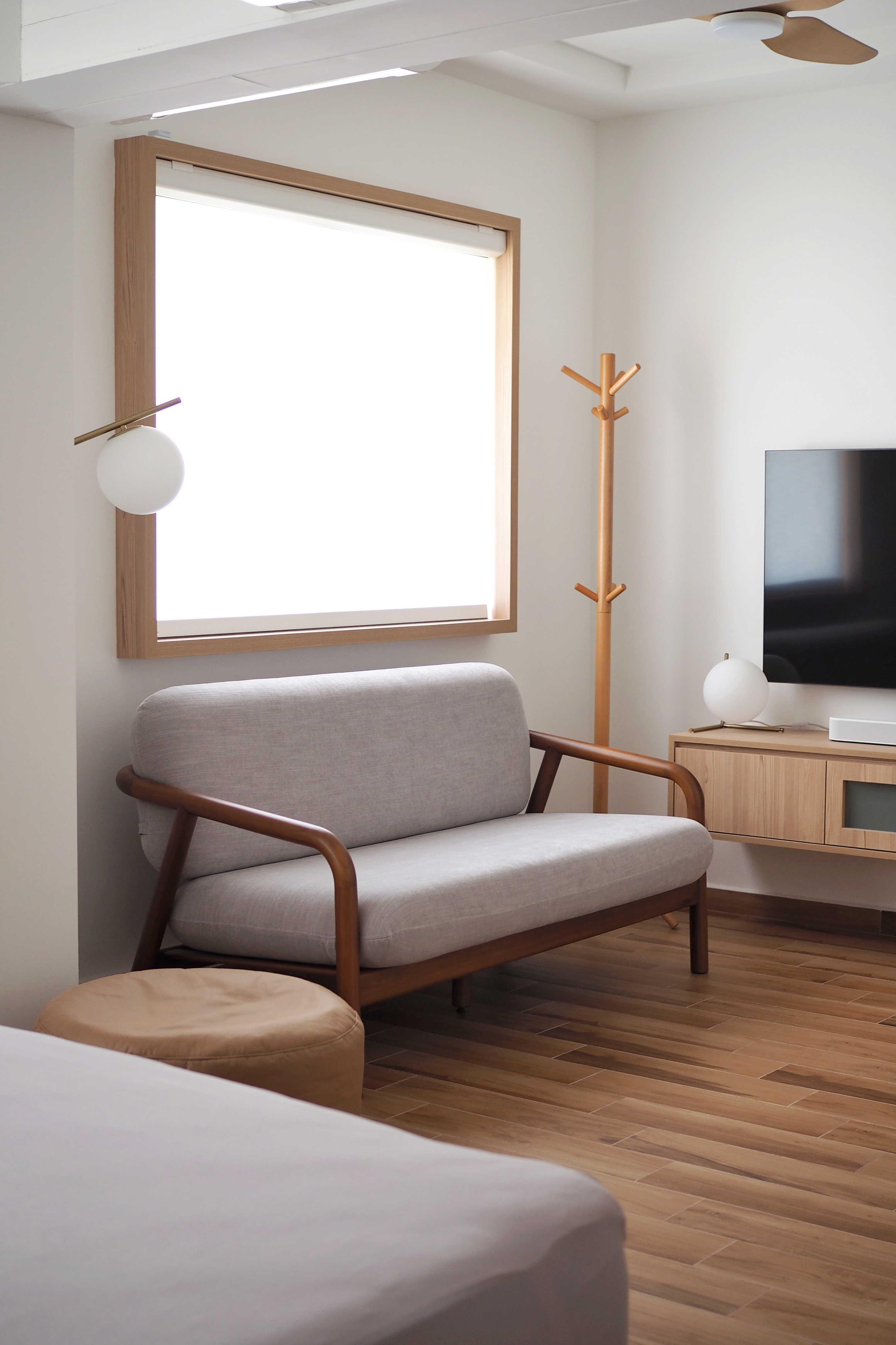 Inspiration from a Staycation: A Lounge Area in Our Bedroom - Modern minimalist living room, cozy seating area, light gray