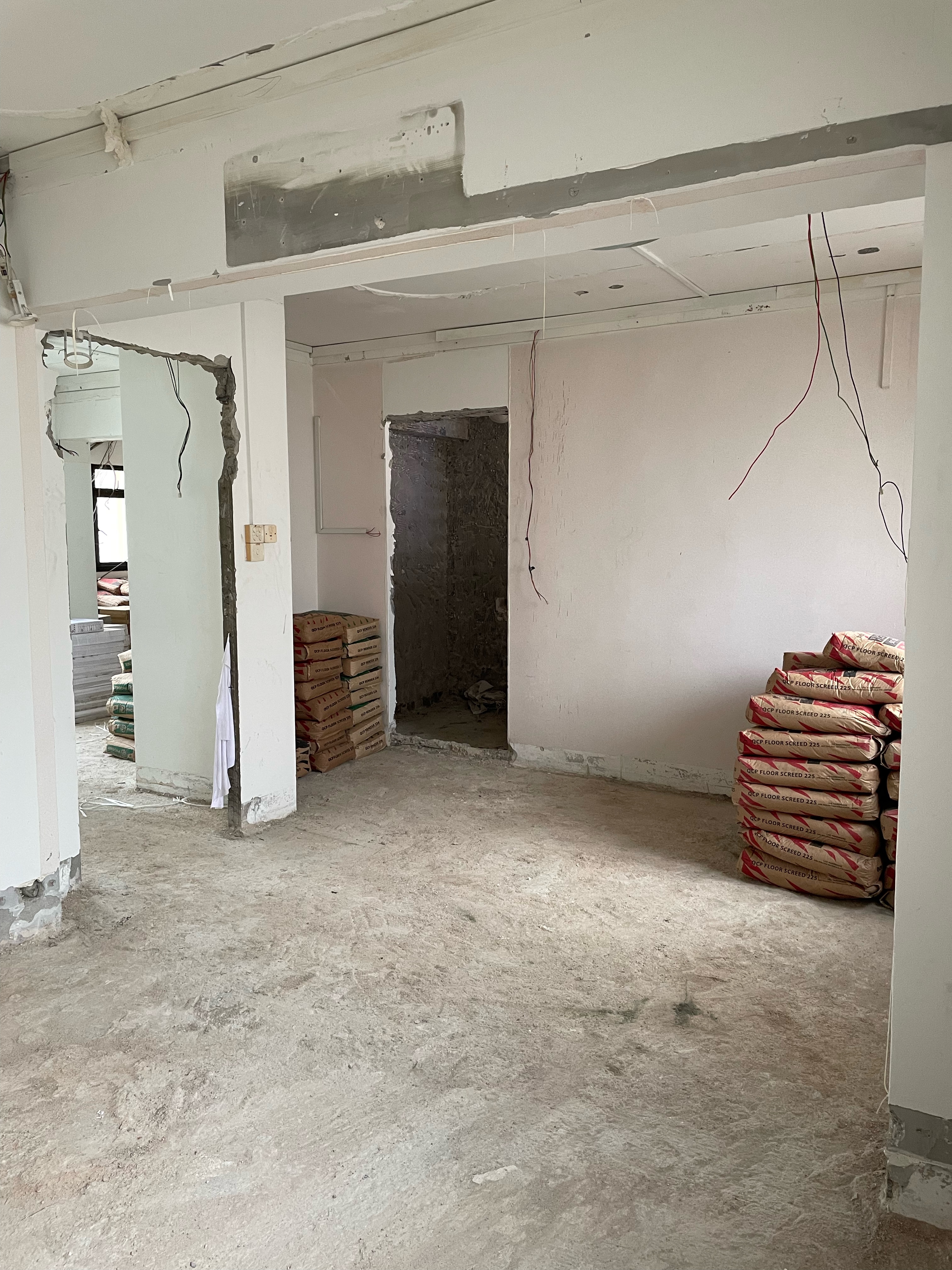 Inspiration from a Staycation: A Lounge Area in Our Bedroom - unfinished room, unfinished walls, exposed ceiling