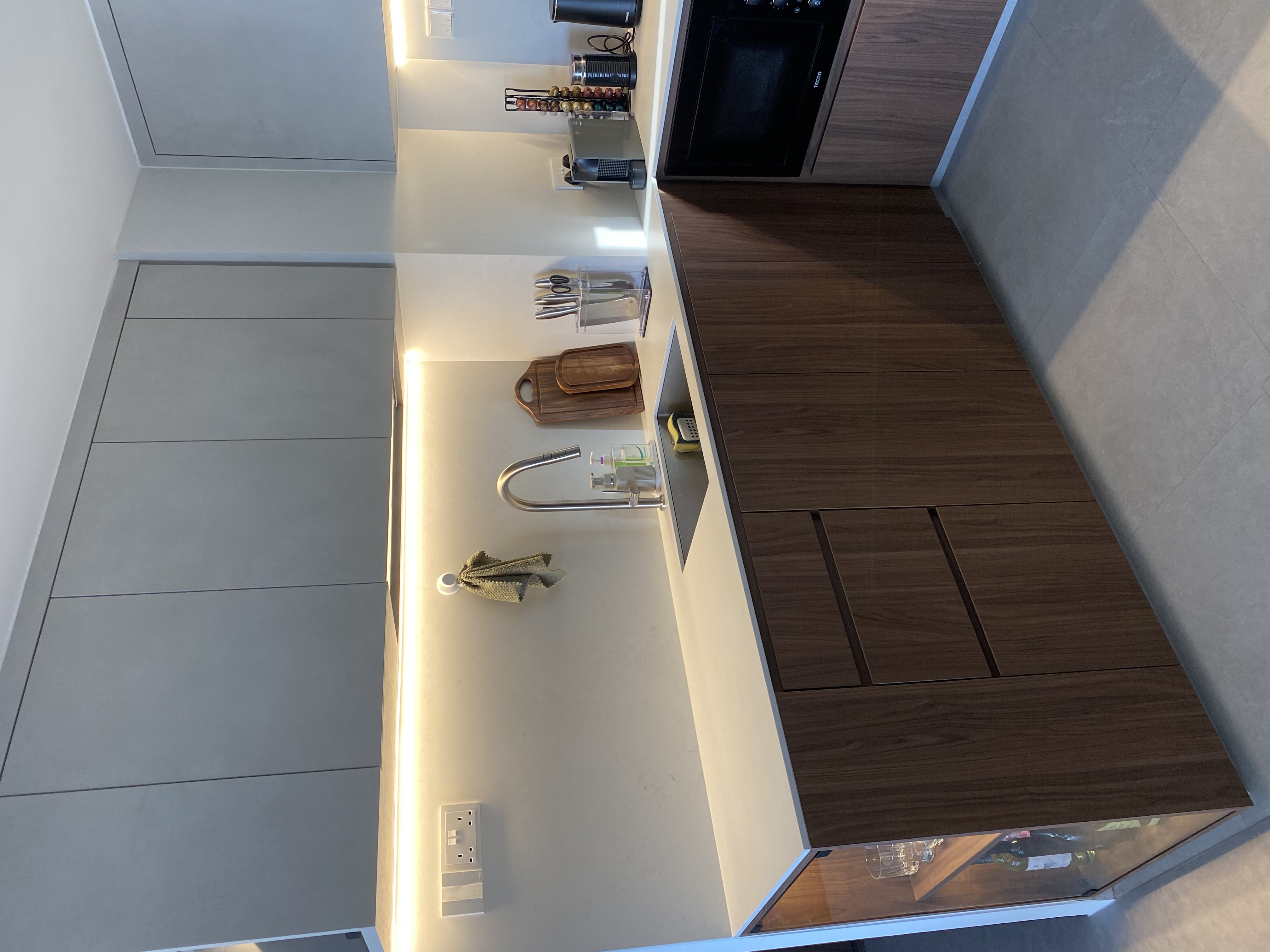 Minimalist kitchen design with maximalist kitchenware & appliances - modern kitchen countertop, sleek cabinets, minimalist