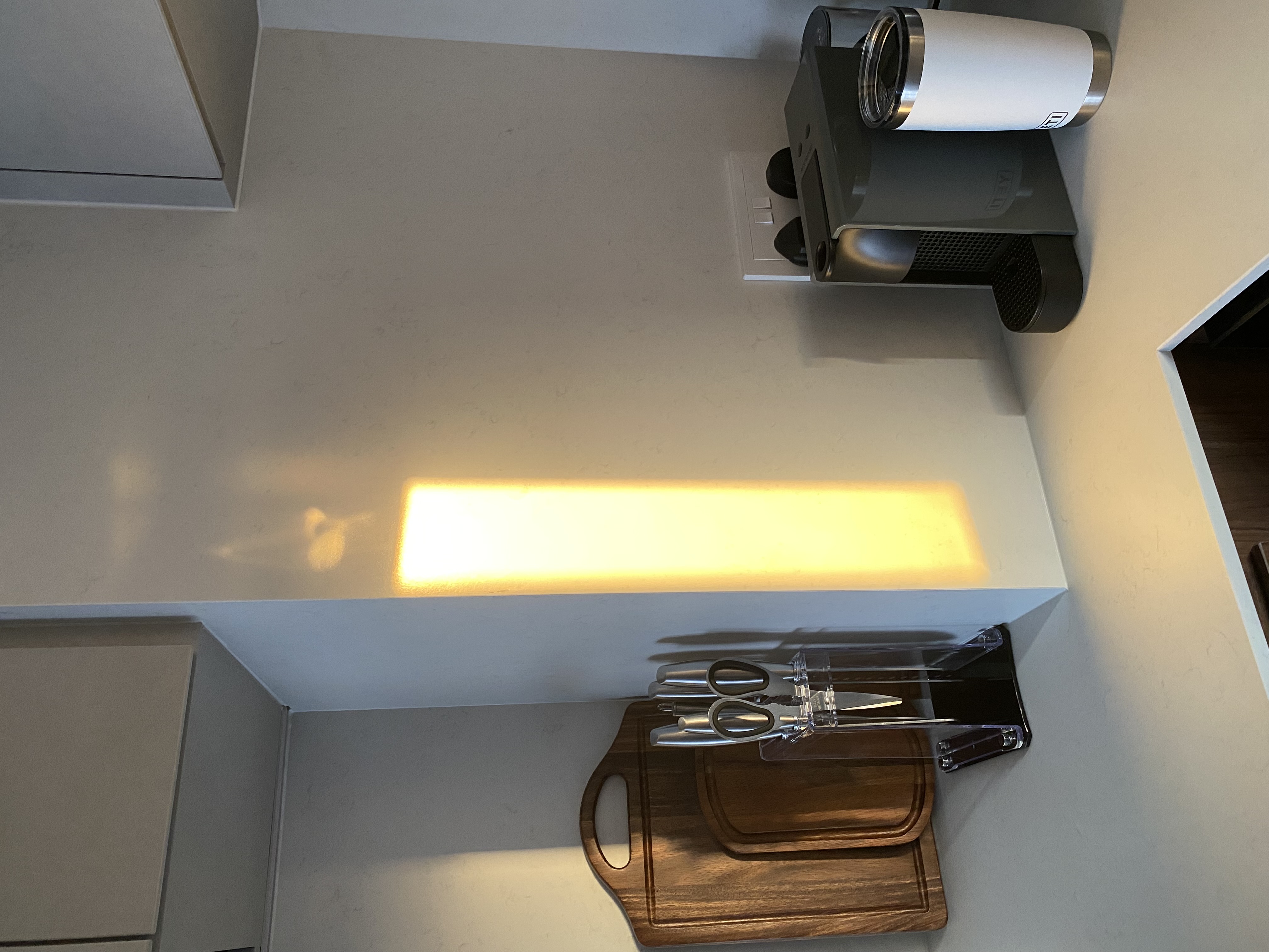 Minimalist kitchen design with maximalist kitchenware & appliances - modern kitchen countertop, sleek appliances, coffee